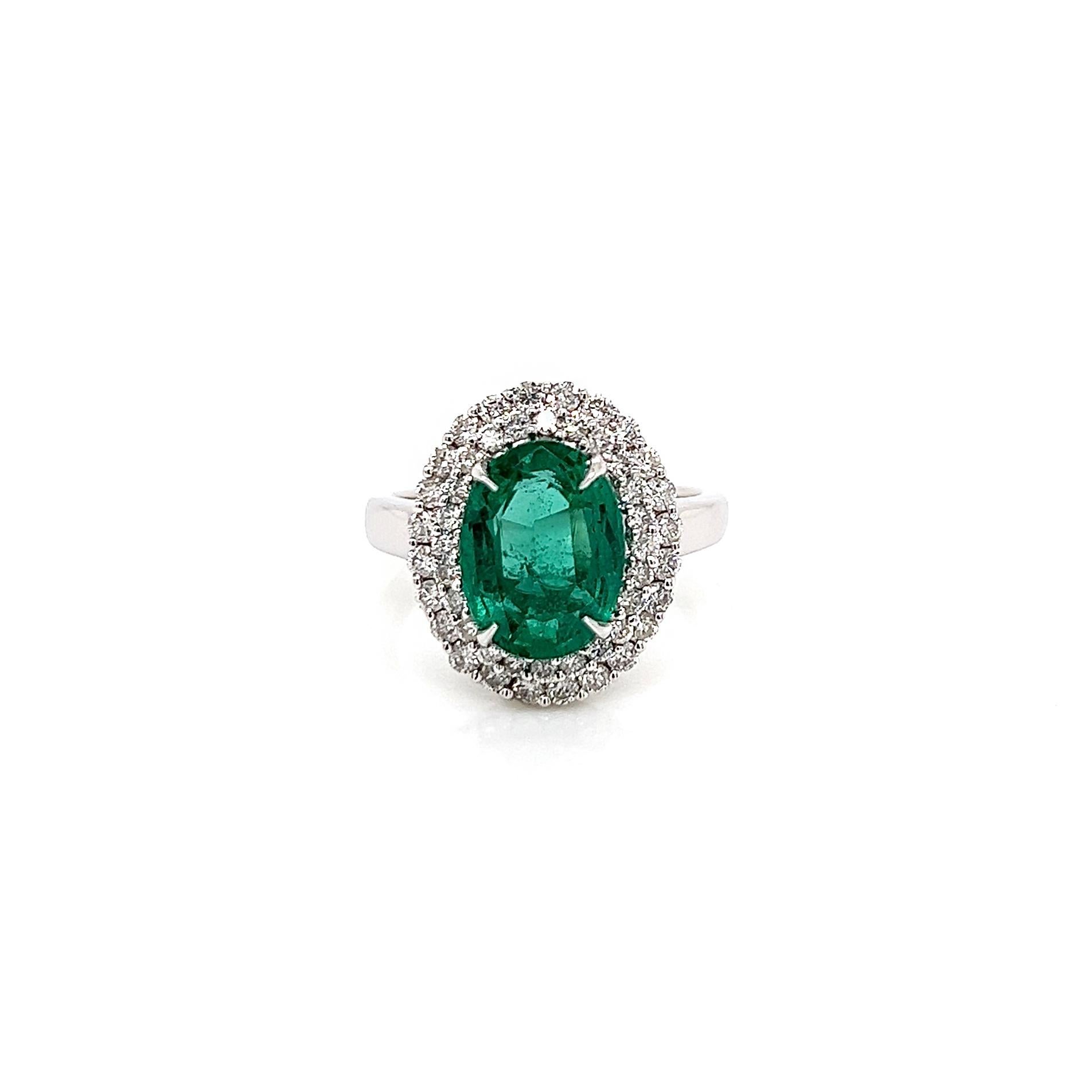 3.83 Total Carat Green Emerald and Diamond Engagement Ring

-Metal Type: 18K White Gold
-3.05 Carat Oval Cut Green Emerald
-0.78 Carat Round Natural Diamonds (Total), G-H Color, SI Clarity
-Size 6.75

Made in New York City