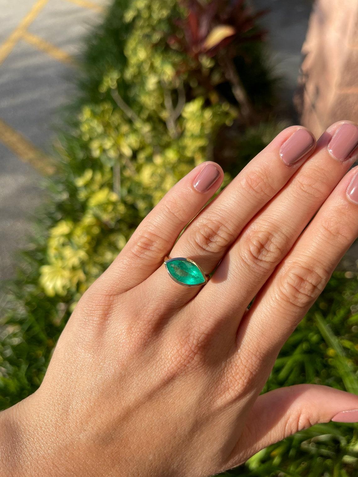 marquise cut emerald ring