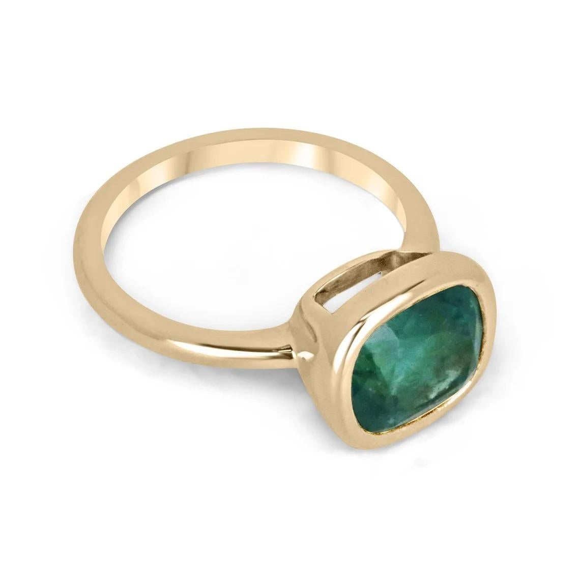 Introducing a captivating solitaire emerald ring that exudes elegance and charm. At its heart lies a remarkable 3.83-carat cushion-cut emerald, boasting a deep ocean green color with a subtle blue tint, reminiscent of serene waters. With good