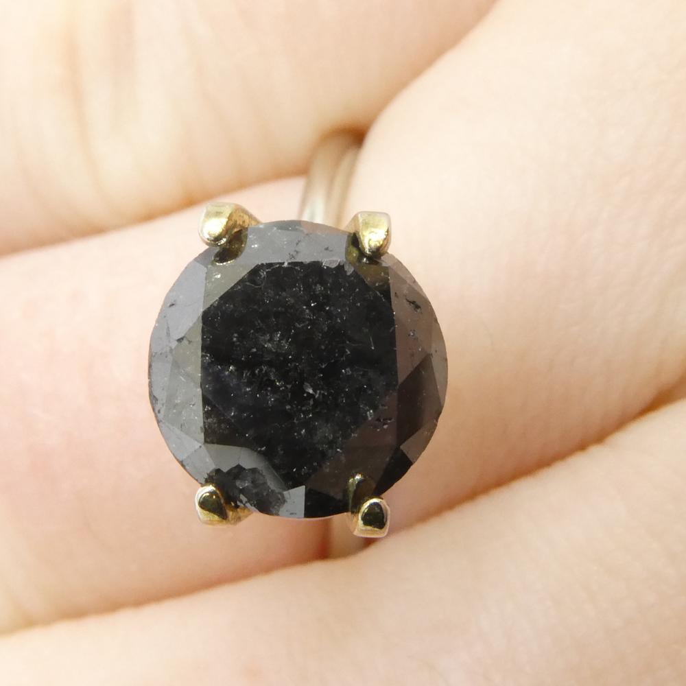Description:

Gem Type: Diamond 
Number of Stones: 1
Weight: 3.83 cts
Measurements: 9.06 x 9.06 x 7.23 mm
Shape: Round
Cutting Style Crown: Brilliant Cut
Cutting Style Pavilion: Brilliant Cut 
Transparency: Opaque
Clarity: N/A
Colour: Black
Hue: