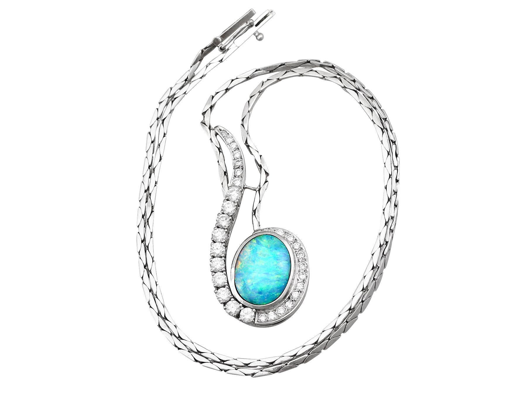 A stunning vintage 3.84 carat opal and 1.86 carat diamond, 18 and 14 karat white gold necklace; part of our diverse opal jewelry and estate jewelry collections.

This stunning, fine and impressive vintage cabochon cut opal pendant has been crafted