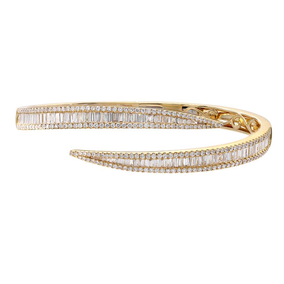 Introducing the stunning and modern Brilliant Fashion Bangle, a true testament to the beauty of diamonds. This exquisite bangle features a central row of vertically-set baguette-cut diamonds, surrounded by framing rows of round-cut diamonds,