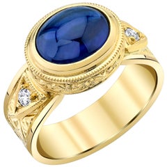 3.85 Carat Sapphire Cabochon, Diamond Yellow Gold Bezel Handmade Engraved Ring