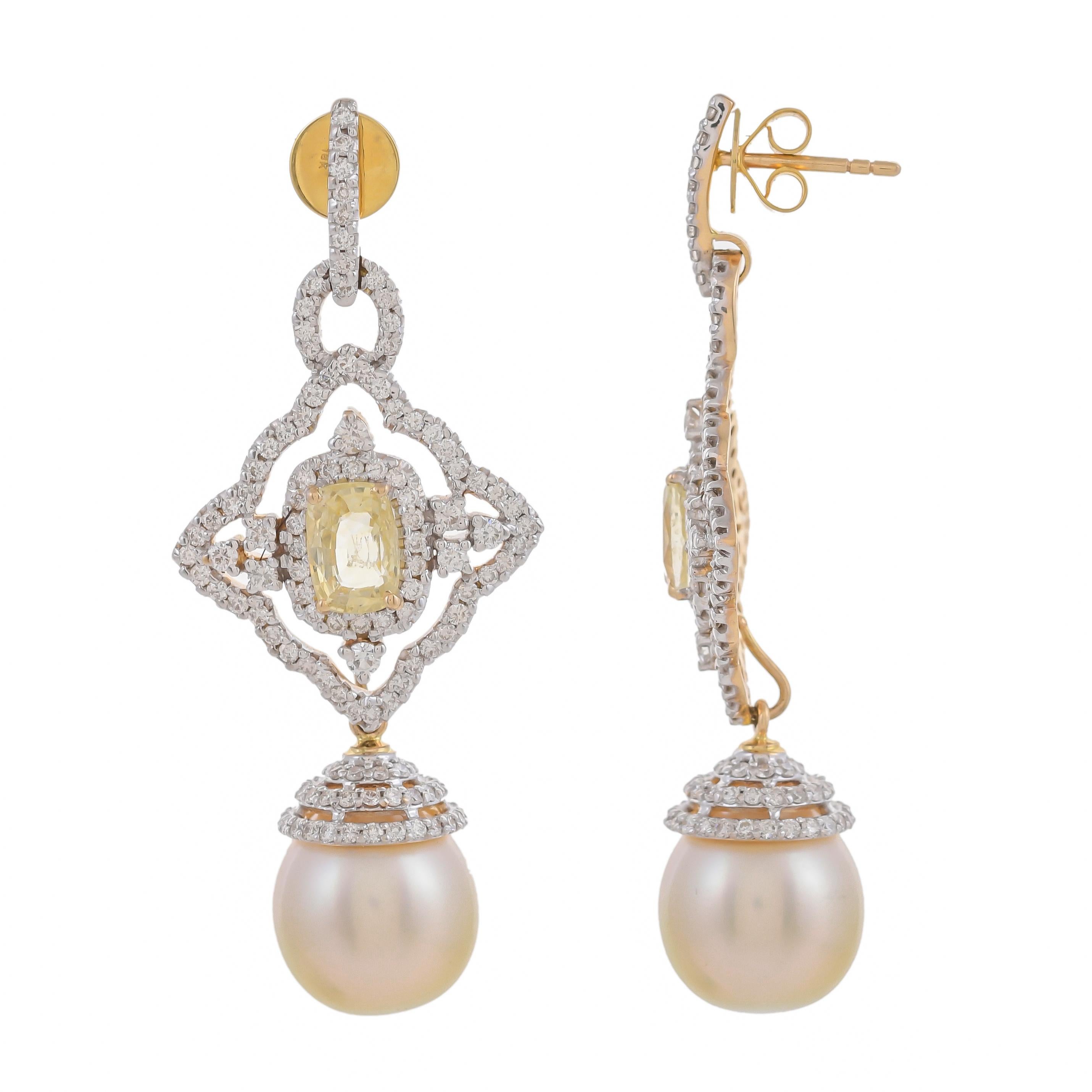 A cocktail earring with a fine octagon-shaped sapphire at the centre. The centre stone has an immediate surround of full-cut diamonds further suspended with South Sea Pearl weighing approximately 35.23 carats with a diamond-set cap, with a total