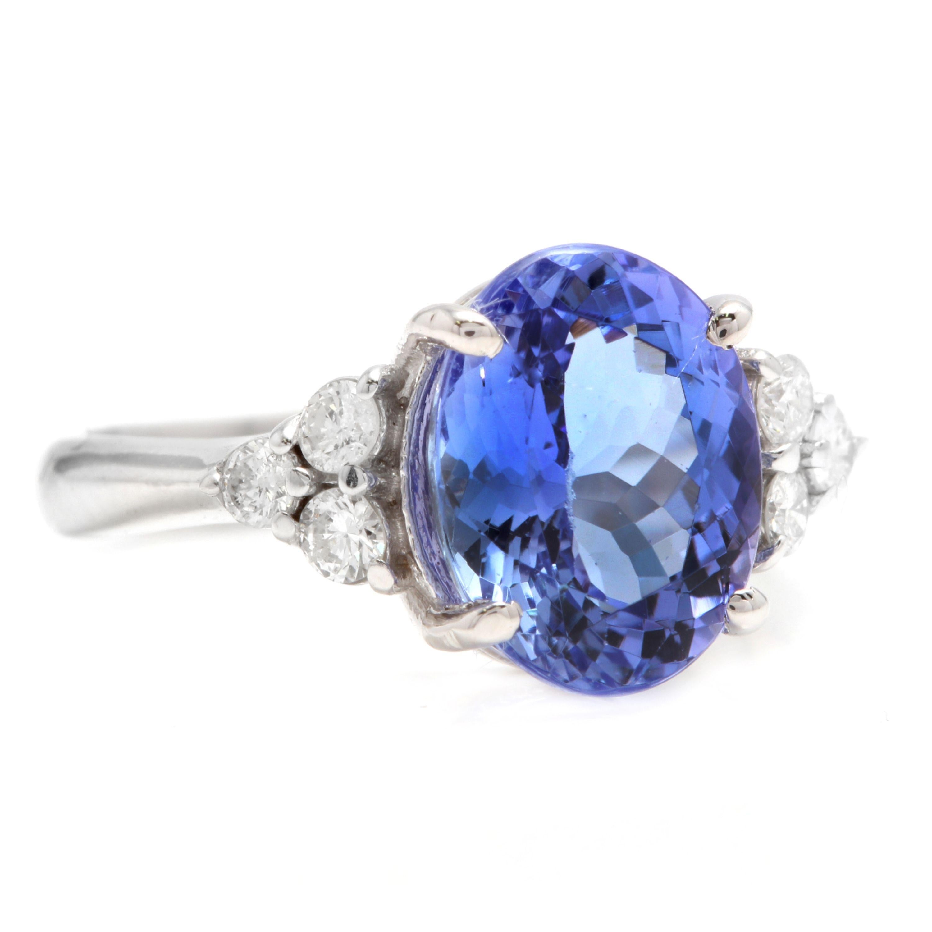 3.85 Carats Natural Very Nice Looking Tanzanite and Diamond 14K Solid White Gold Ring

Total Natural Oval Cut Tanzanite Weight is: Approx. 3.50 Carats

Tanzanite Measures: 11.00 x 9.00

Natural Round Diamonds Weight: Approx. 0.35 Carats (color G-H /