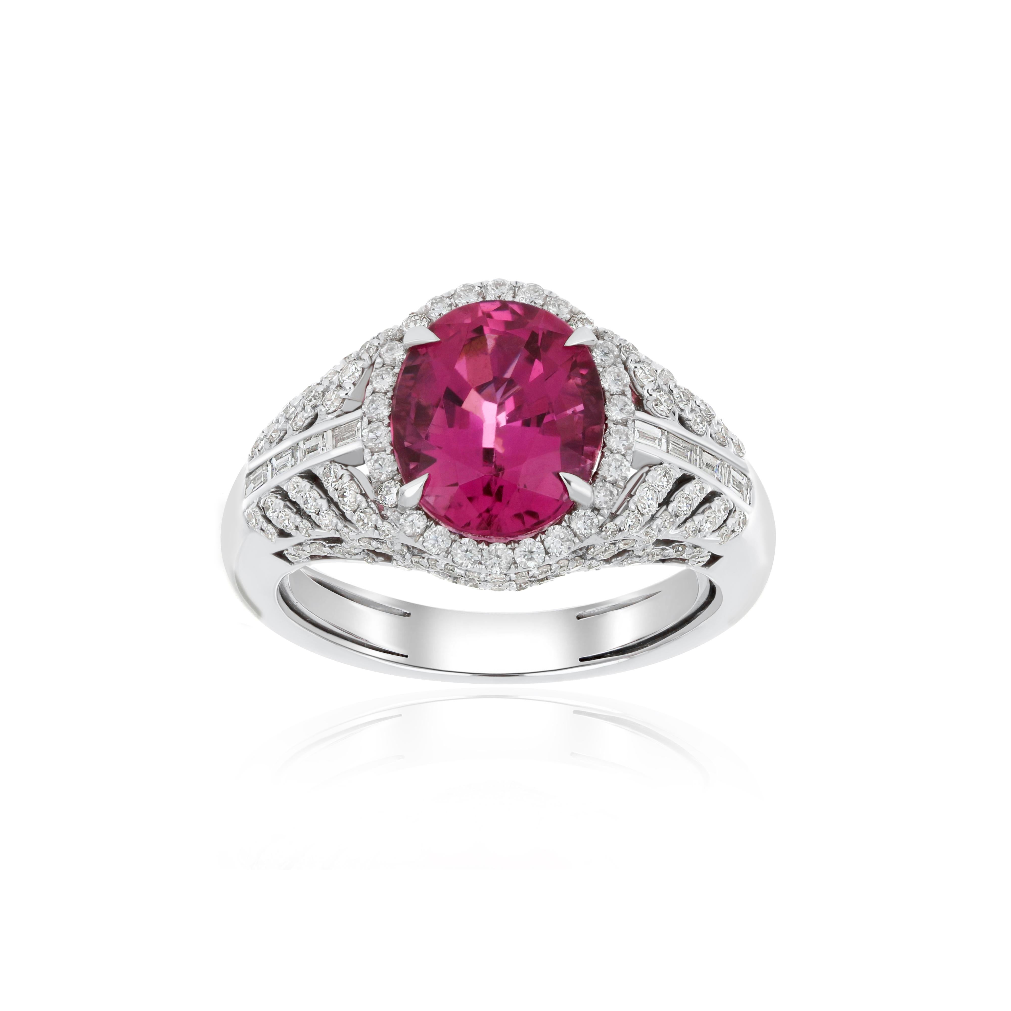 Elegant and exquisitely detailed 18K White Gold Ring, with 3.85 Cts Oval Shape Rubellite set in center and Surrounded by Micro pave Diamonds, weighing approx. 0.95 CT's. total carat weight to further enhance the beauty of the ring. Beautifully Hand
