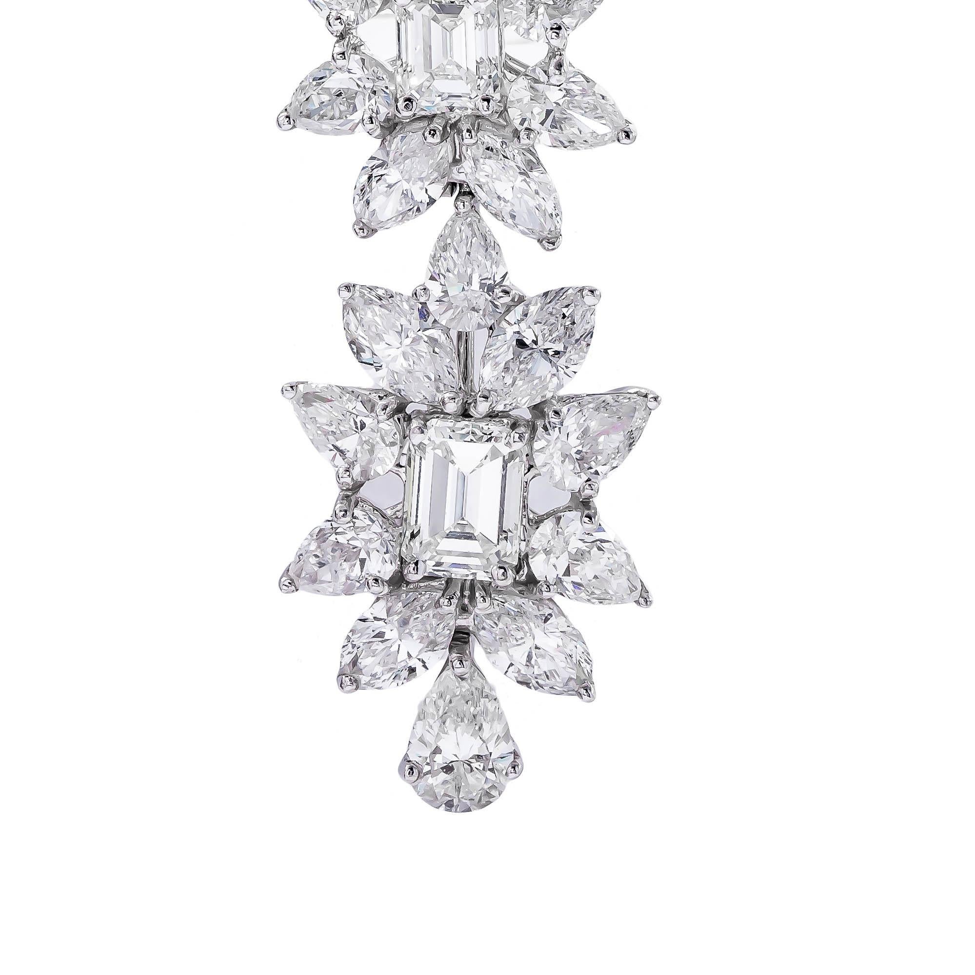 Platinum 38.50 carat diamond fancy flower drop earrings featuring emerald-cut diamonds, pear-shape diamonds, and marquise-cut diamonds, with a color and clarity of F VVS2-VS1 respectively. They measure 3.5 inches long
