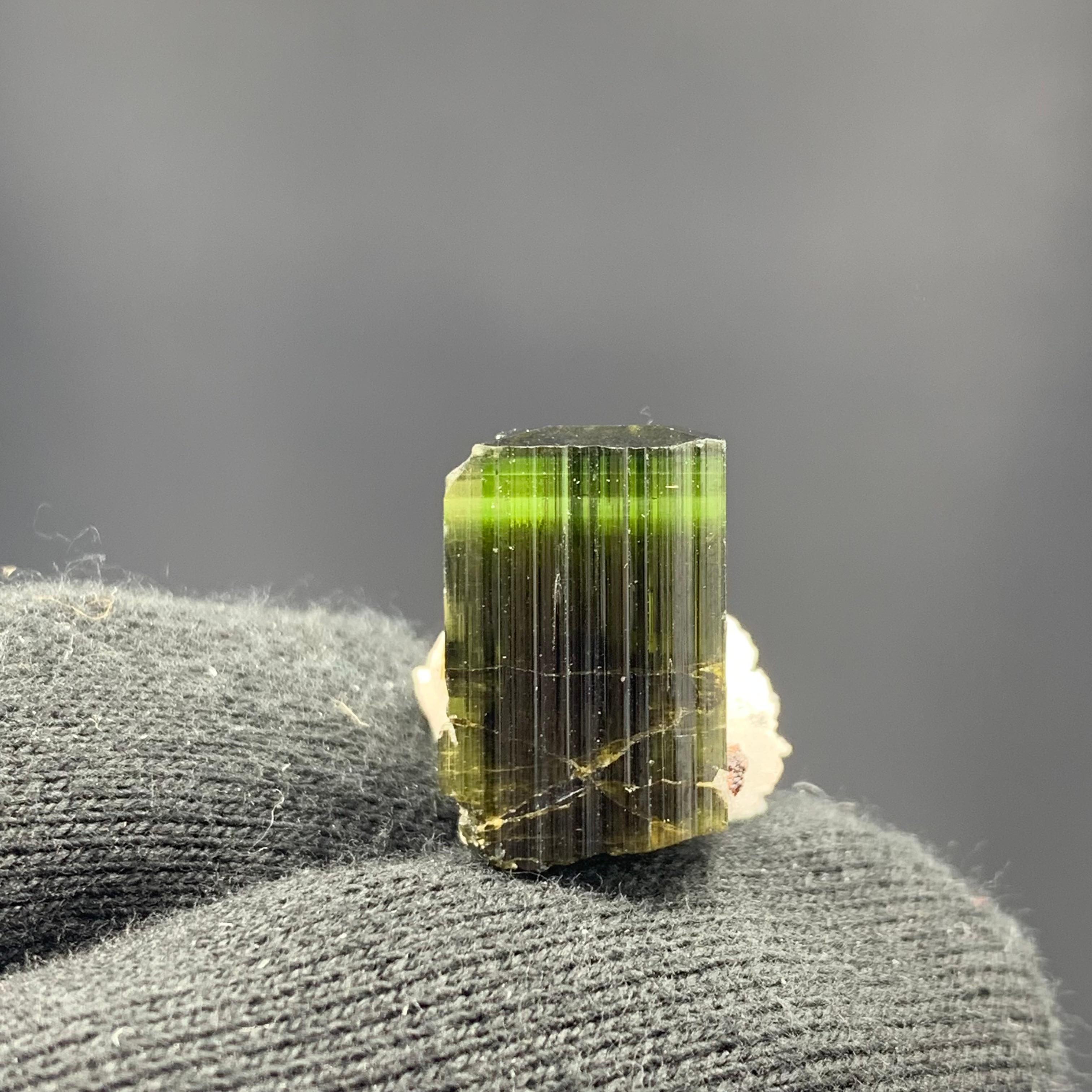 38.55 Carat Adorable Tourmaline Specimen With Albite From Skardu, Pakistan 

Weight: 38.55 Carat
Dimension: 1.9 x 1.6 x 2.1 Cm
Origin: Stak Nala, Skardu Valley, Pakistan 

Tourmaline is a crystalline silicate mineral group in which boron is