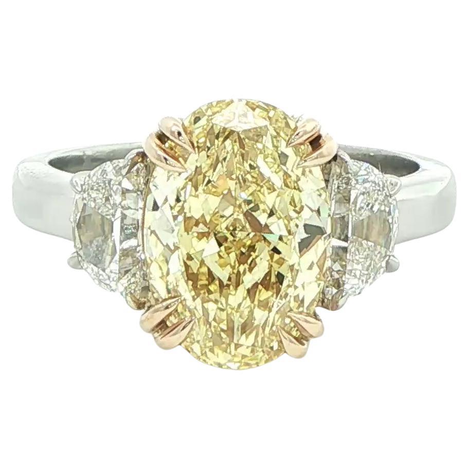3.81ct. Fancy Yellow Oval-Cut Diamond 
Half Moon Diamond Ring in 18KY Gold 
PT For Sale