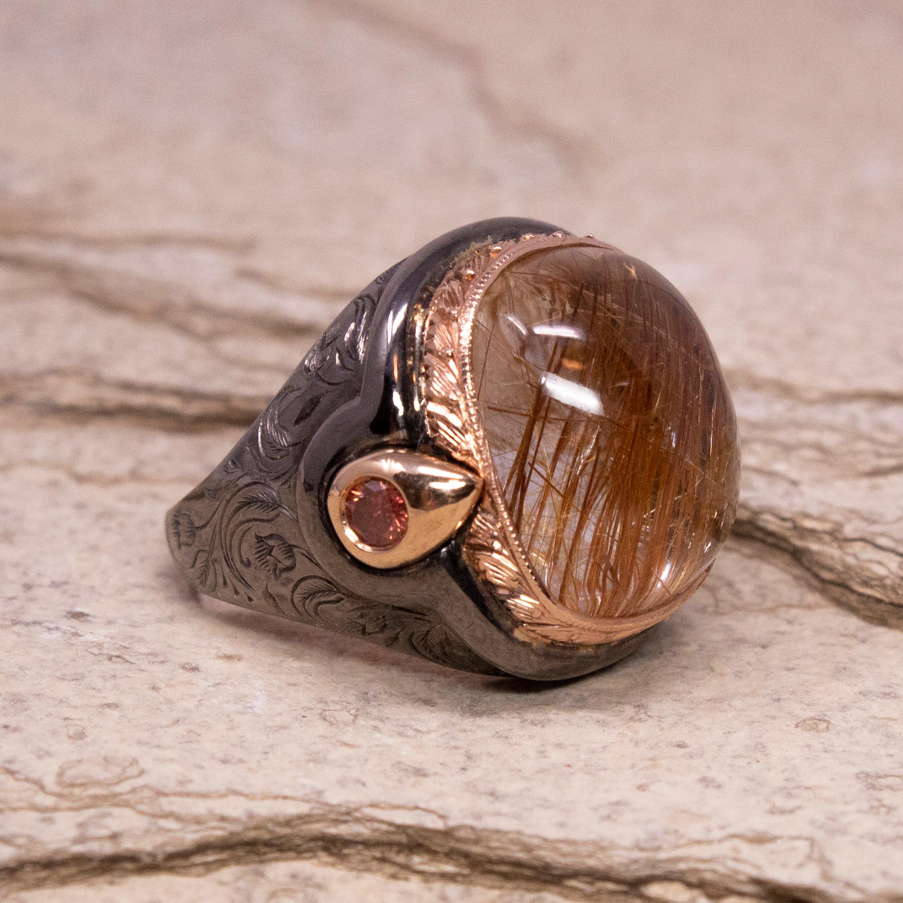 Rutillated Quartz can be such a beautiful inspiration for jewelry design. This ring features a gorgeous large cabochon with just the right amount of coppery-gold rutile needles playing throughout; the color of the rutile is dramatically enhanced