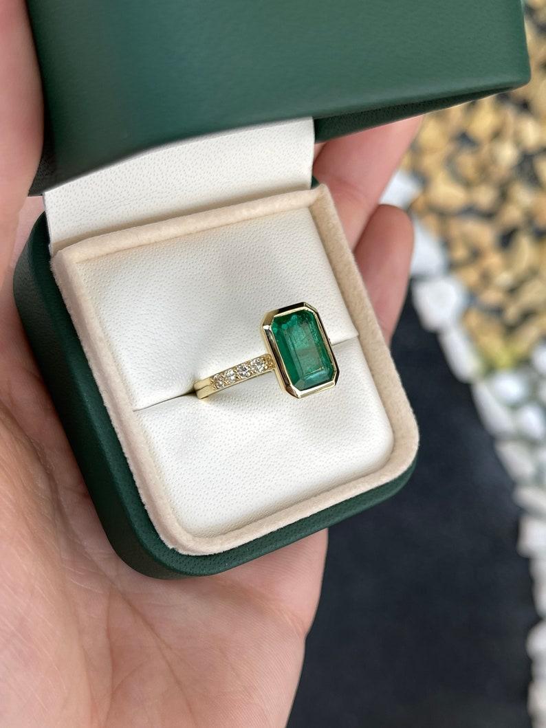 3.85tcw Emerald Cut Emerald & Diamond Accent 18K Yellow Gold Engagement Ring In New Condition For Sale In Jupiter, FL