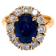 3.86 Carat Blue Sapphire and Diamond Cluster Ring set in 18K Yellow Gold