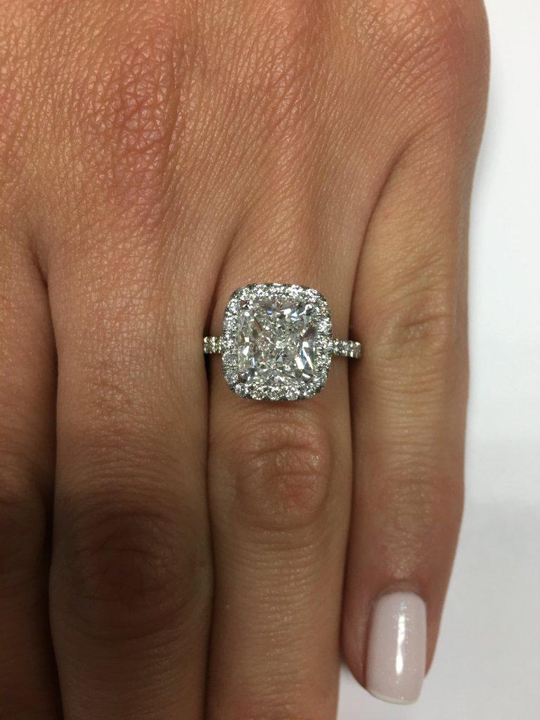 This exceptionally beautiful 3.86 ct diamond engagement ring will astonish you with its incredible cut, quality, value, design and brilliance combination! The perfect 3.01 ct cushion cut diamond poised in the center of this platinum setting is GIA
