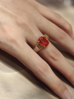 3.86 Carat Oval Orange Sapphire Diamond Pavé Ring Flanked with Square Peridots