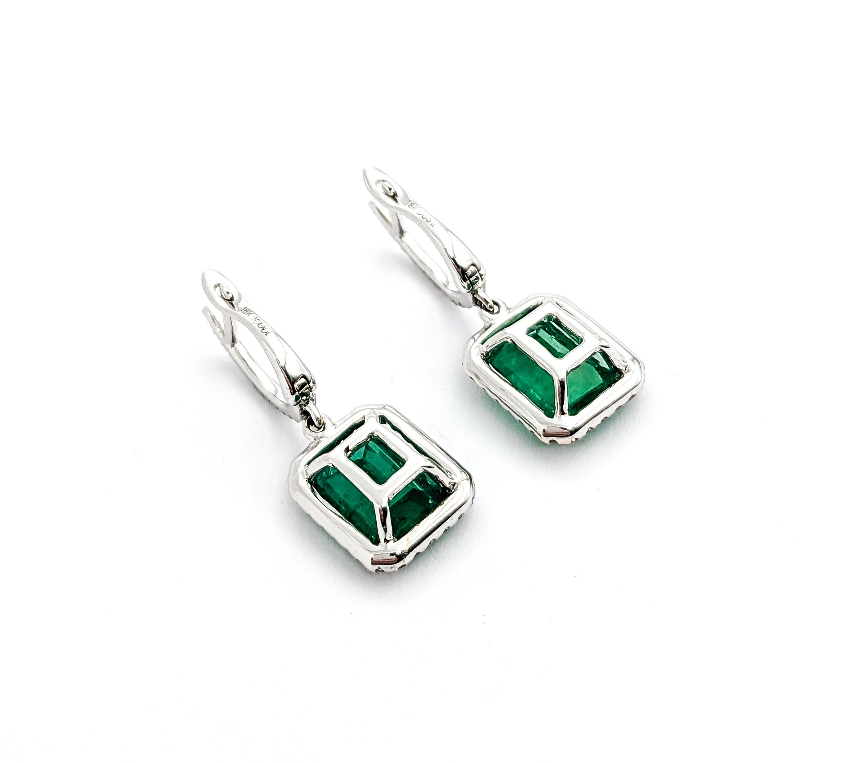Emerald Cut 3.86ctw Emerald & Diamond Dangle Earrings In White Gold