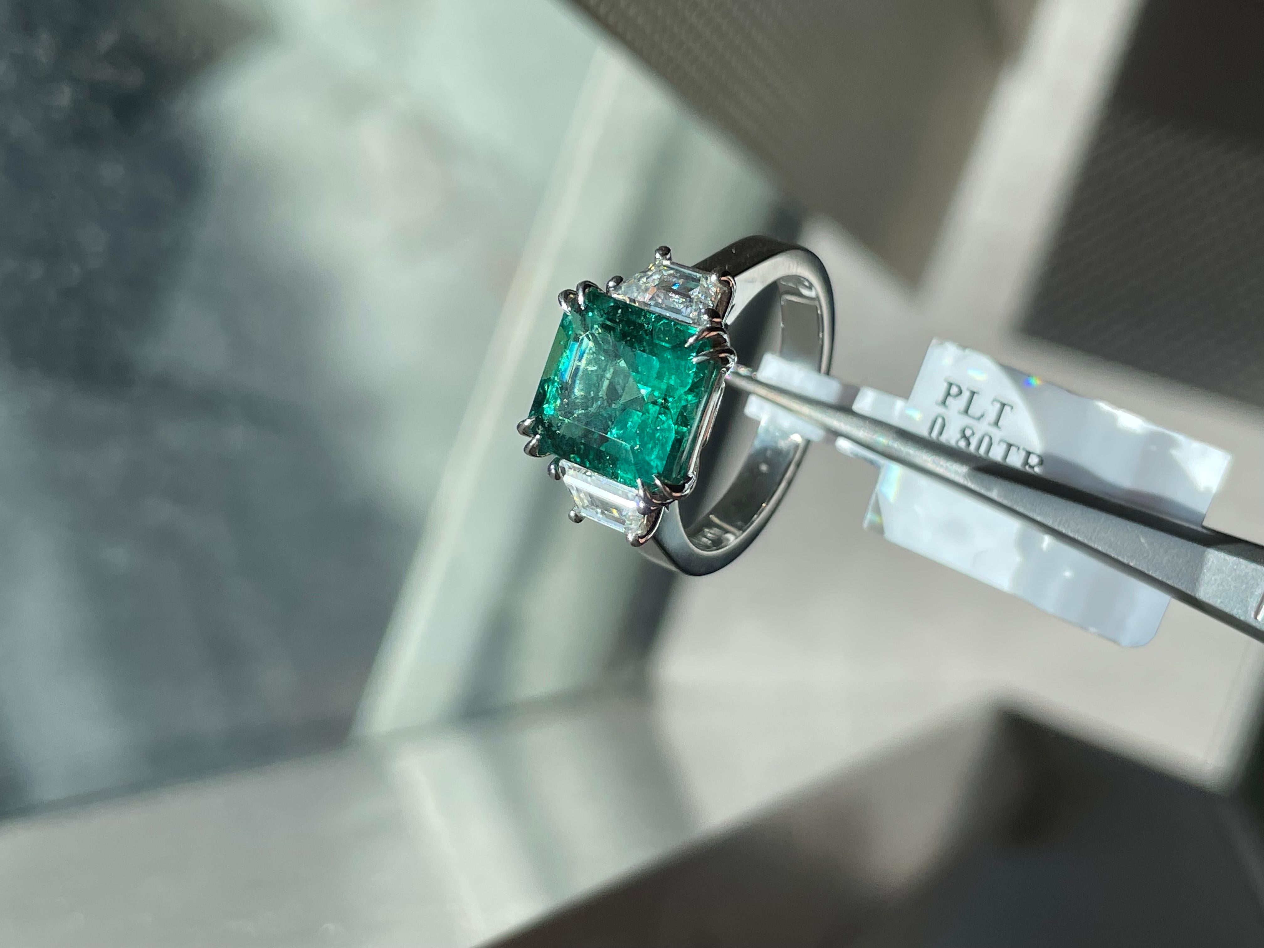 Spectacular Natural 3.87 Carat Emerald Radiant Cut 3 Stone Ring W/ Trapezoid Side Stones

Setting:
Platinum

Center Stone:
Natural 3.87ct Carat Emerald Radiant Cut
Origin: Zambian 

Side Stones: Natural Trapezoid Diamonds
Color: G-H
Clarity: VS
Cut: