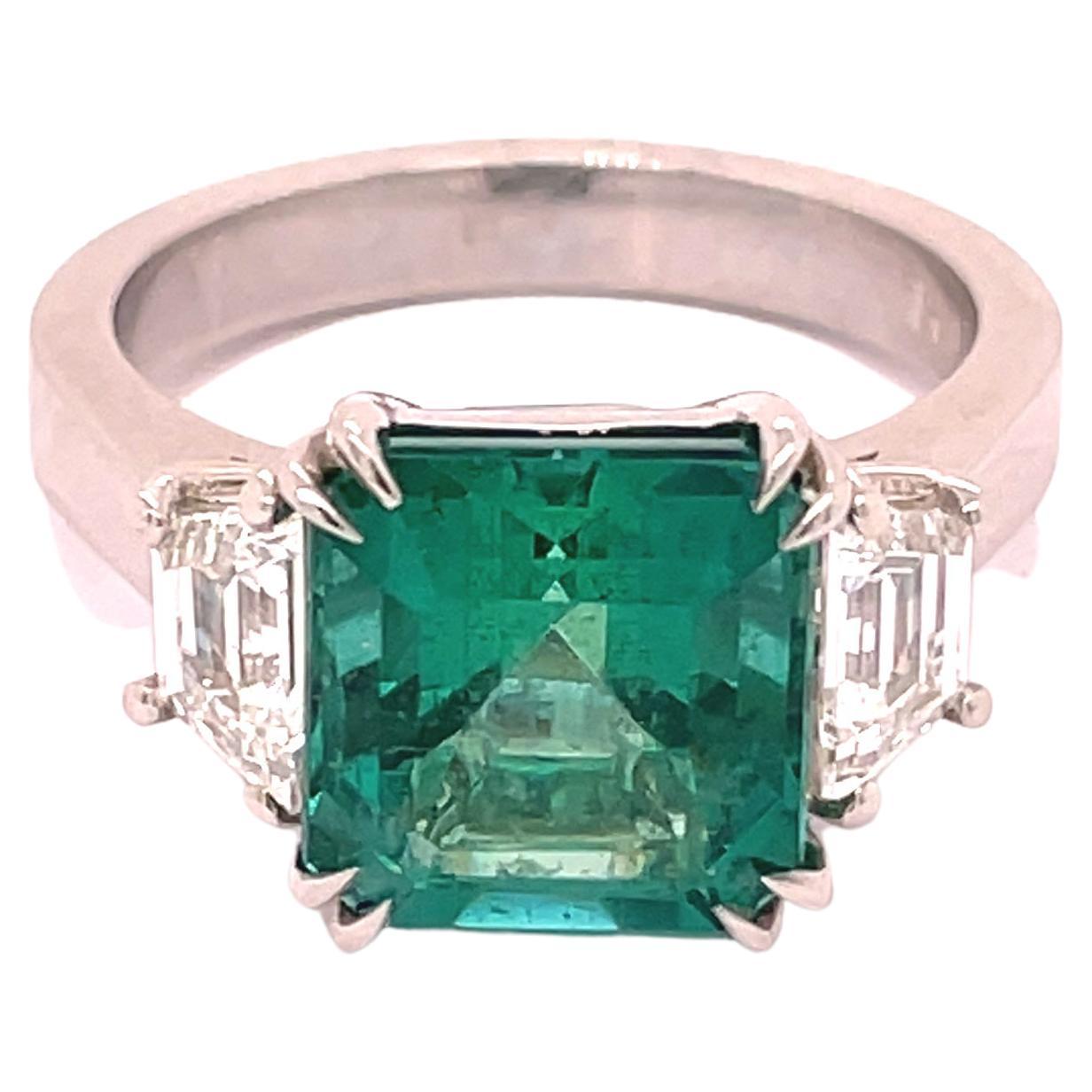 3.87 Carat Natural Emerald Radiant Cut 3 Stone Ring W/ Trapezoid Side Stones  For Sale
