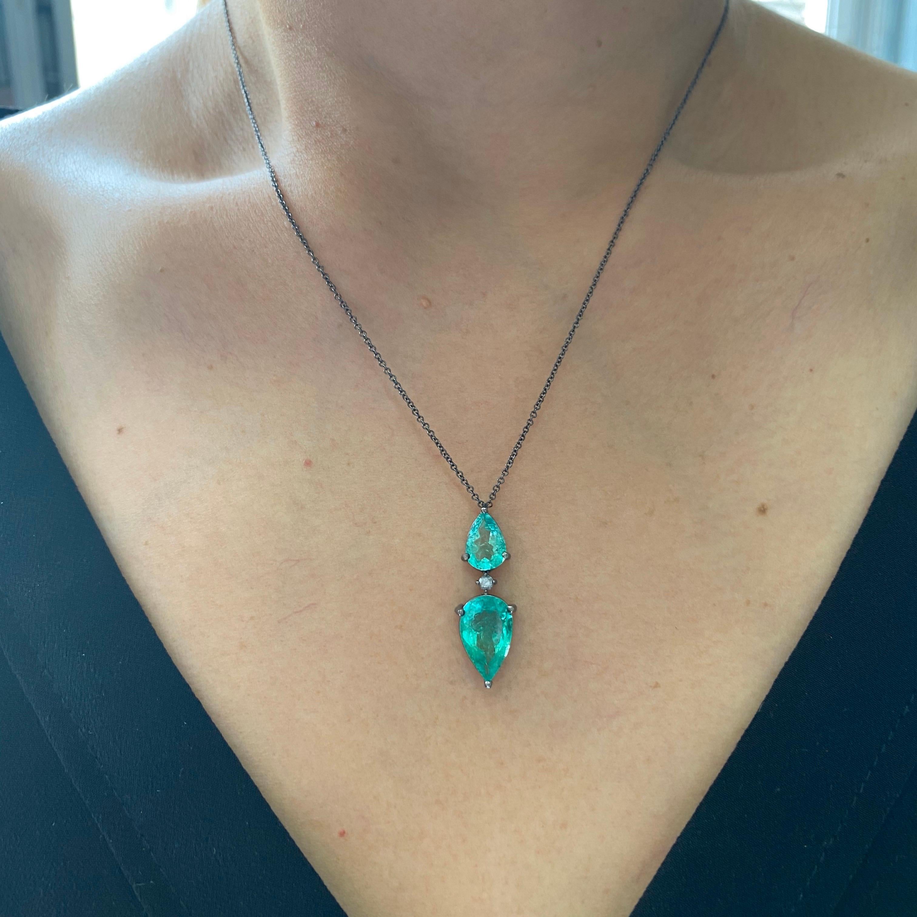 A simple, modern looking 3.87 carat Colombian Emerald pendant attached to 16 inch chain, all set in black rhodium plated 18K Gold. Certificate can be provided upon request. A video can be provided as well. The length of the chain can be altered,