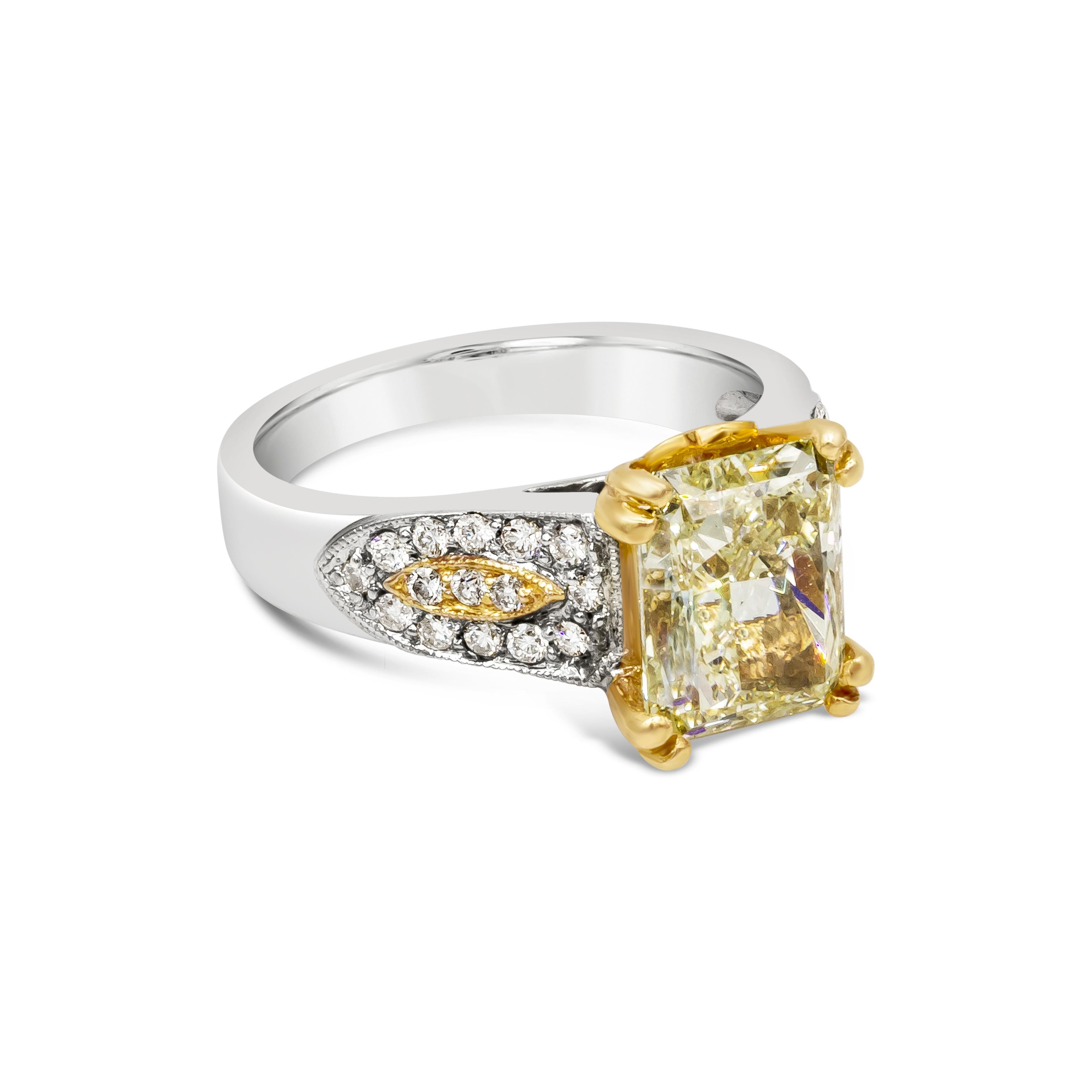 Rare and color rich engagement ring featuring a vibrant 3.87 carats elongated radiant cut diamond certified by GIA as fancy yellow and VS2 in clarity, set in a double claw prongs 18K yellow gold basket. Flanking the center stone are three rows of
