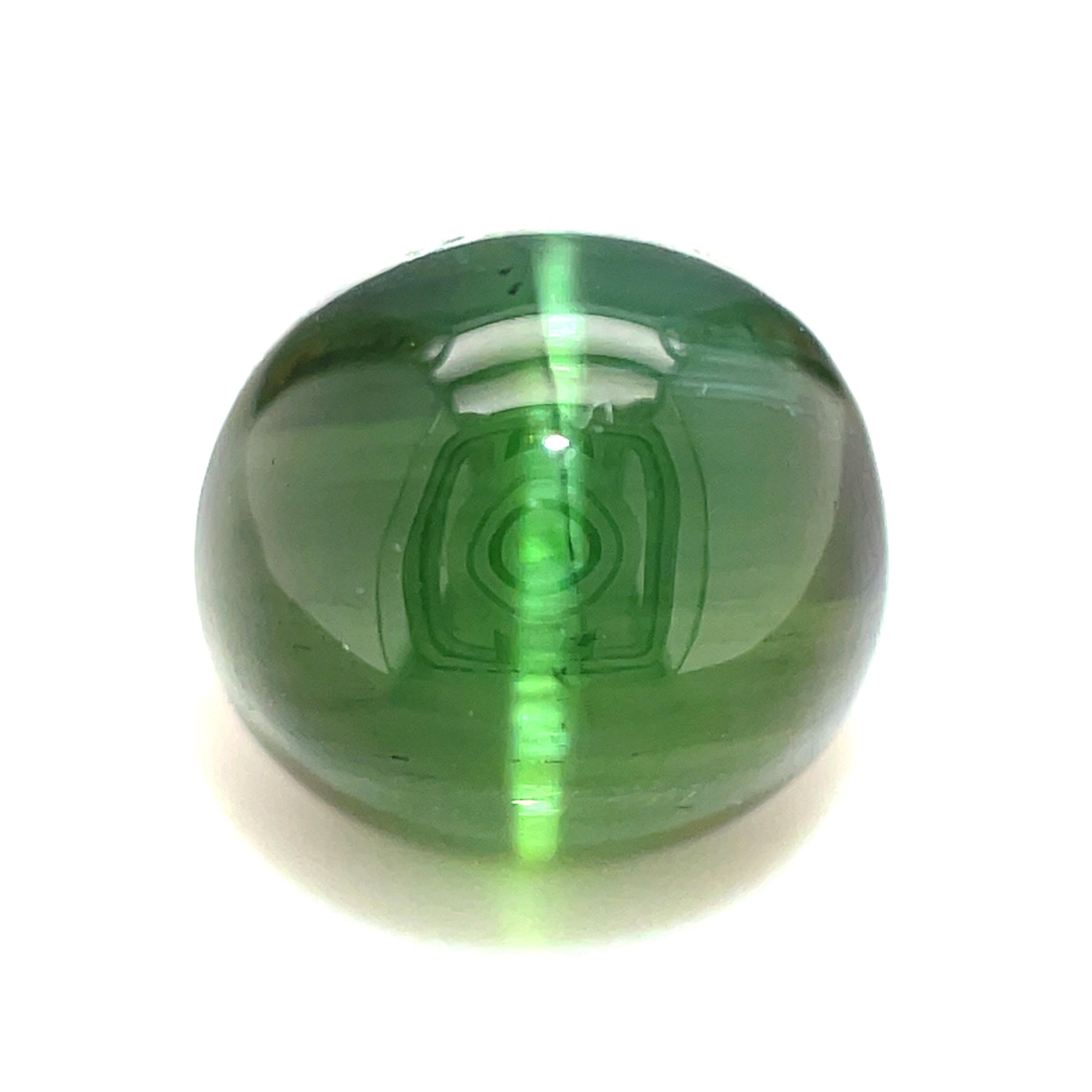 This lovely green cat's eye tourmaline is a rare occurance in nature. Weighing 3.87 carats and measuring 8.72 x 8.34 x 6.12 millimeters, this is the perfect size for a ring. The clear, sharp and straight eye dances across a translucent, spearmint