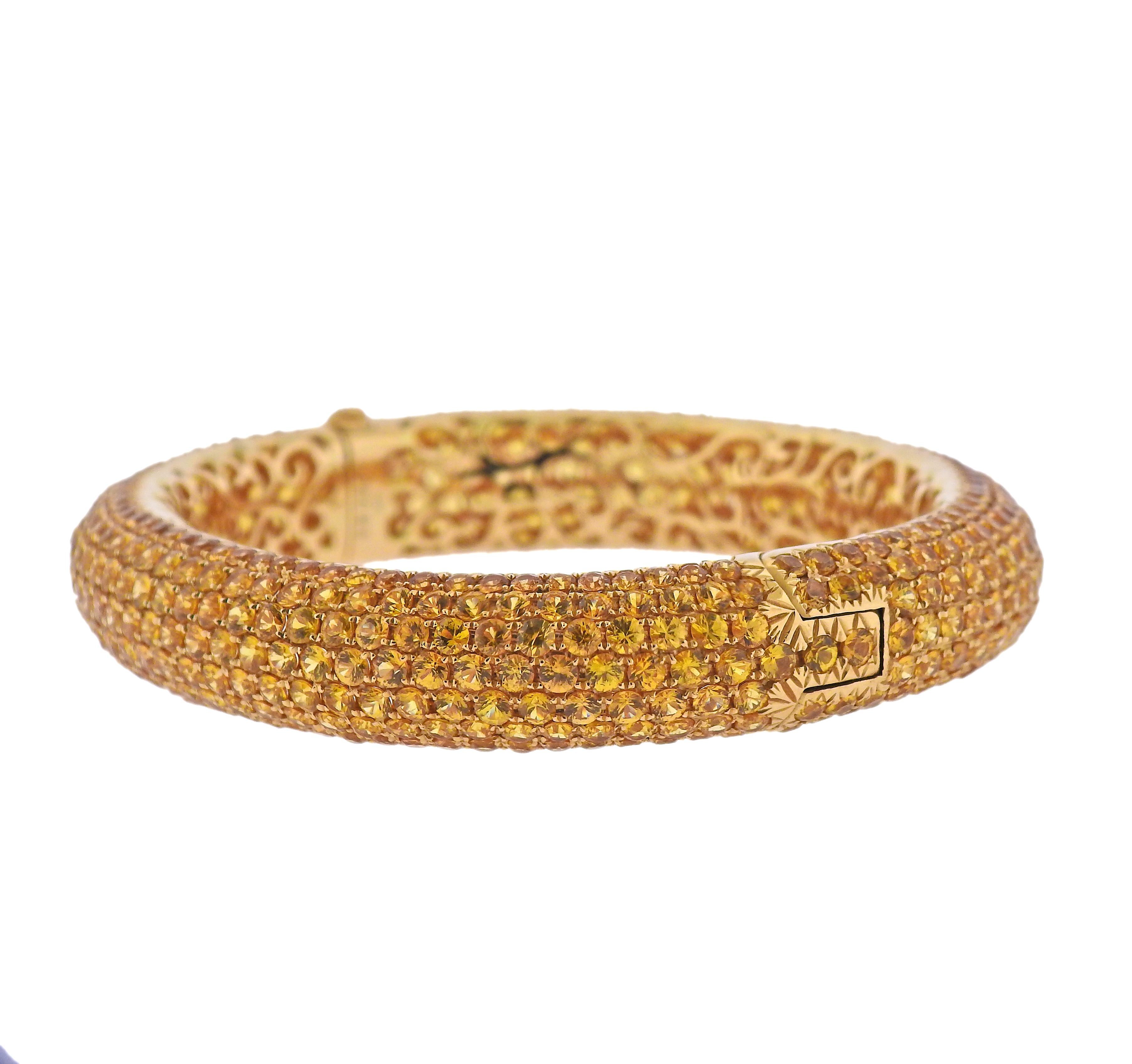 18k gold bangle bracelet, decorate with 38.77 carats in yellow sapphires. Bracelet will fit up to 7.5