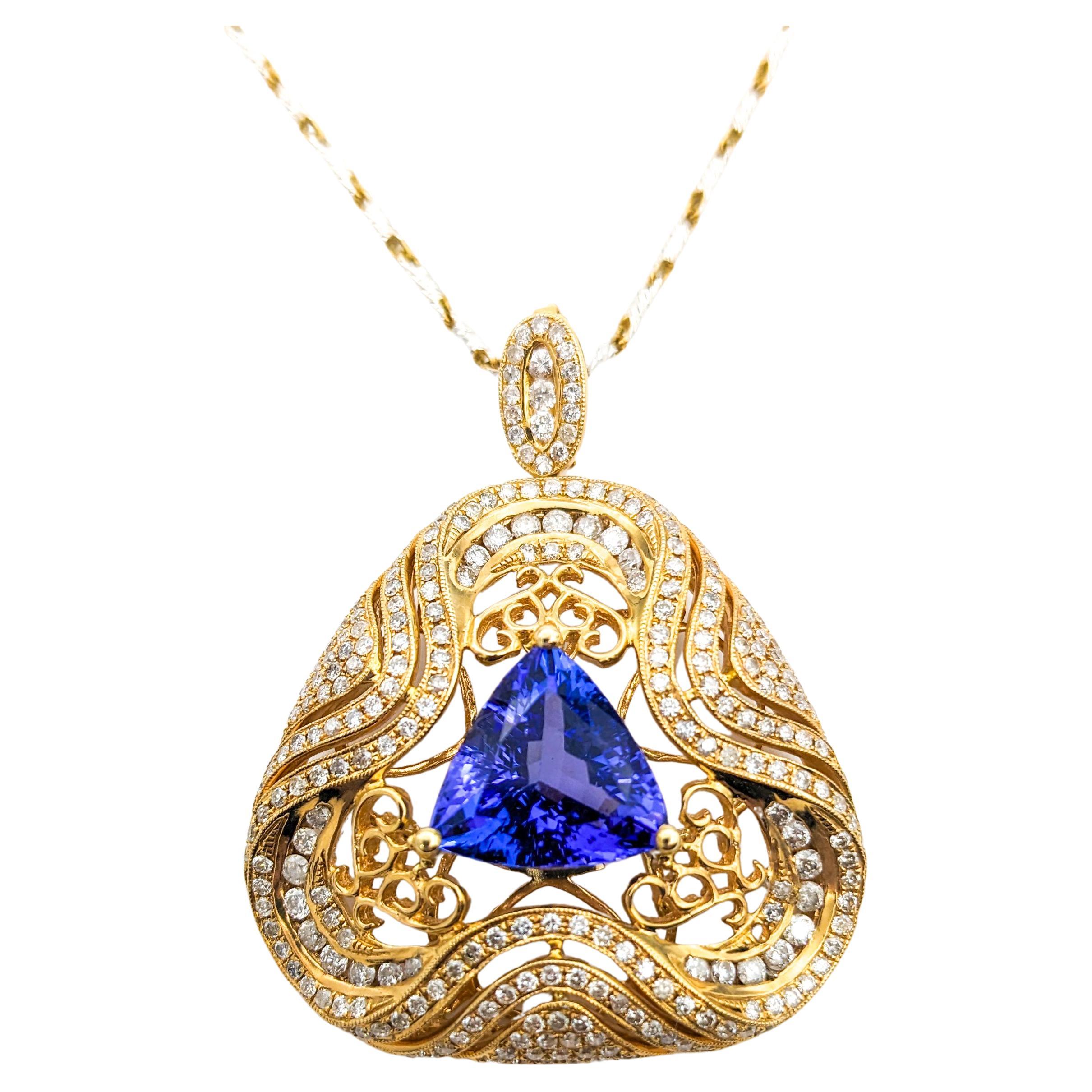 3.87ct Tanzanite & 2.24ctw Diamond Pendant Necklace In Two-Tone Gold

Introducing this exquisite 3.87ct Tanzanite Necklace crafted in 14K Two-Tone Gold, a perfect blend of elegance and modern design. The Trillion Cut Tanzanite is gorgeous with its