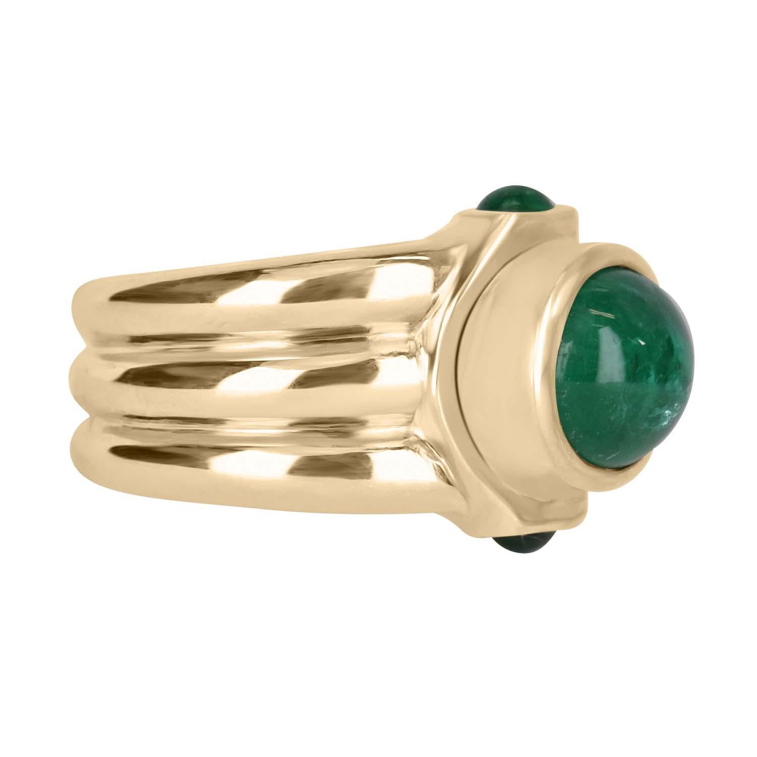 A one of a kind men's natural emerald cabochon ring. Featuring the center stone, with a full 3.42-carat cabochon with a beautiful dark green color. Accented by two smaller cabochons totaling 0.45tcw set north to south. All stones are carefully bezel
