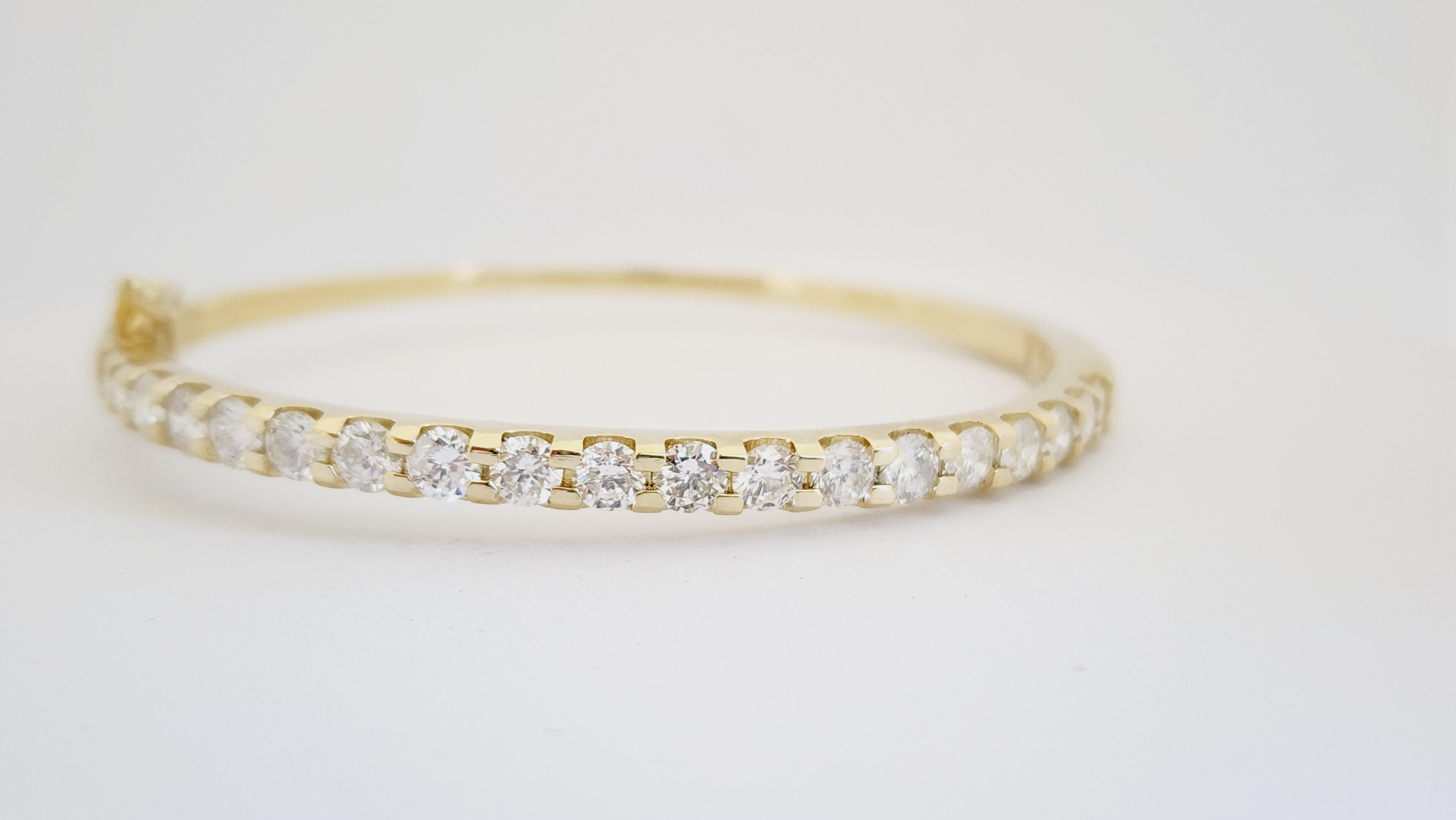 Natural Diamonds 3.88 ctw flexible half way around bangle yellow gold 14k 7 Inch. 
Average Color G Clarity I, 3.8 mm wide.

*Free shipping within the U.S.*