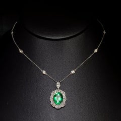 3.88 Carat Oval cut Emerald and Diamond Drop Necklace in 18K WhiteGold