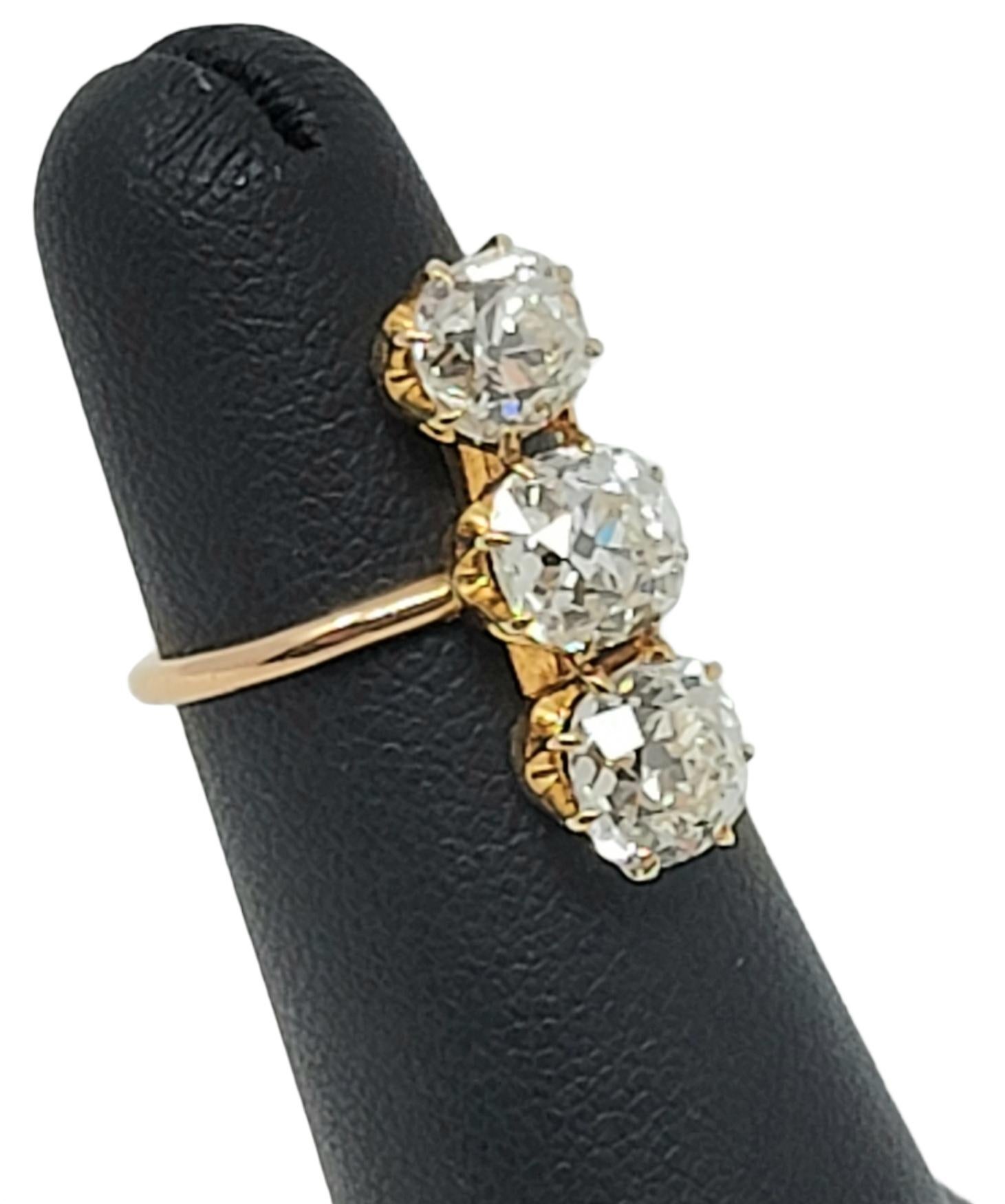 3.88 Carat Total Three-Stone Old Mine Cut Diamond Elongated 14 Karat Gold Ring For Sale 3