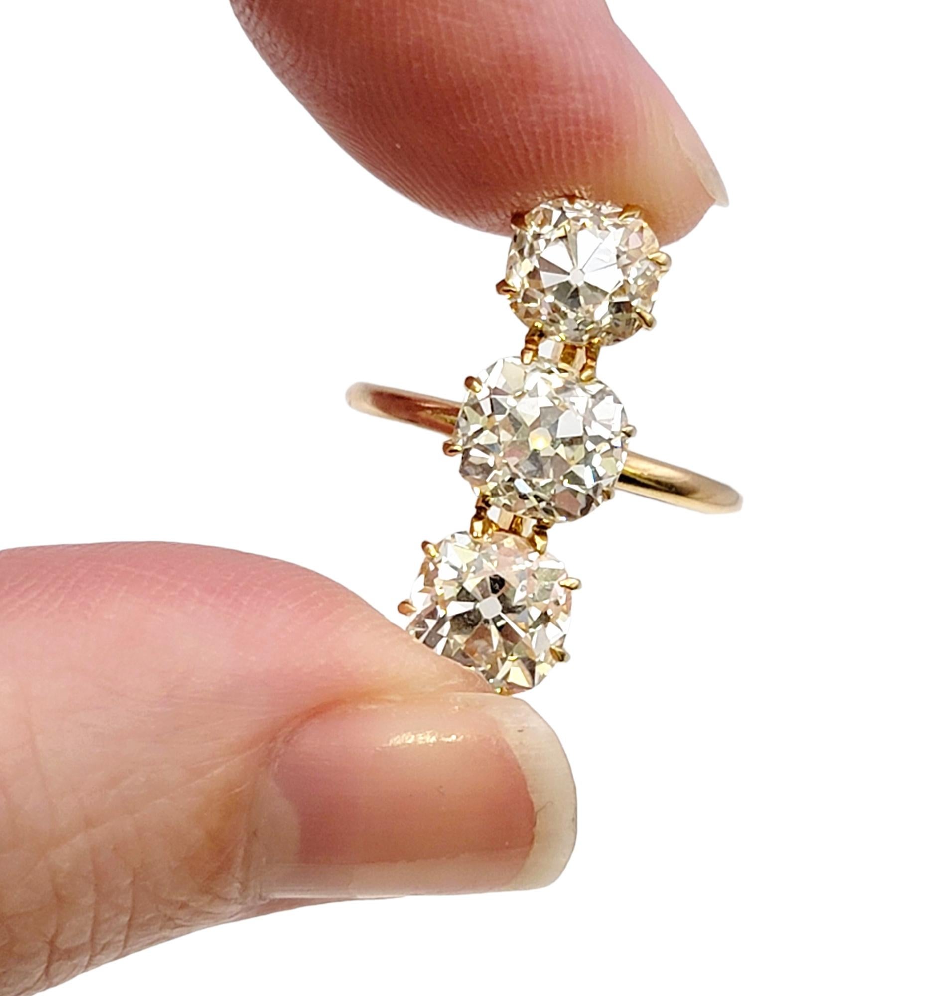 3.88 Carat Total Three-Stone Old Mine Cut Diamond Elongated 14 Karat Gold Ring For Sale 4