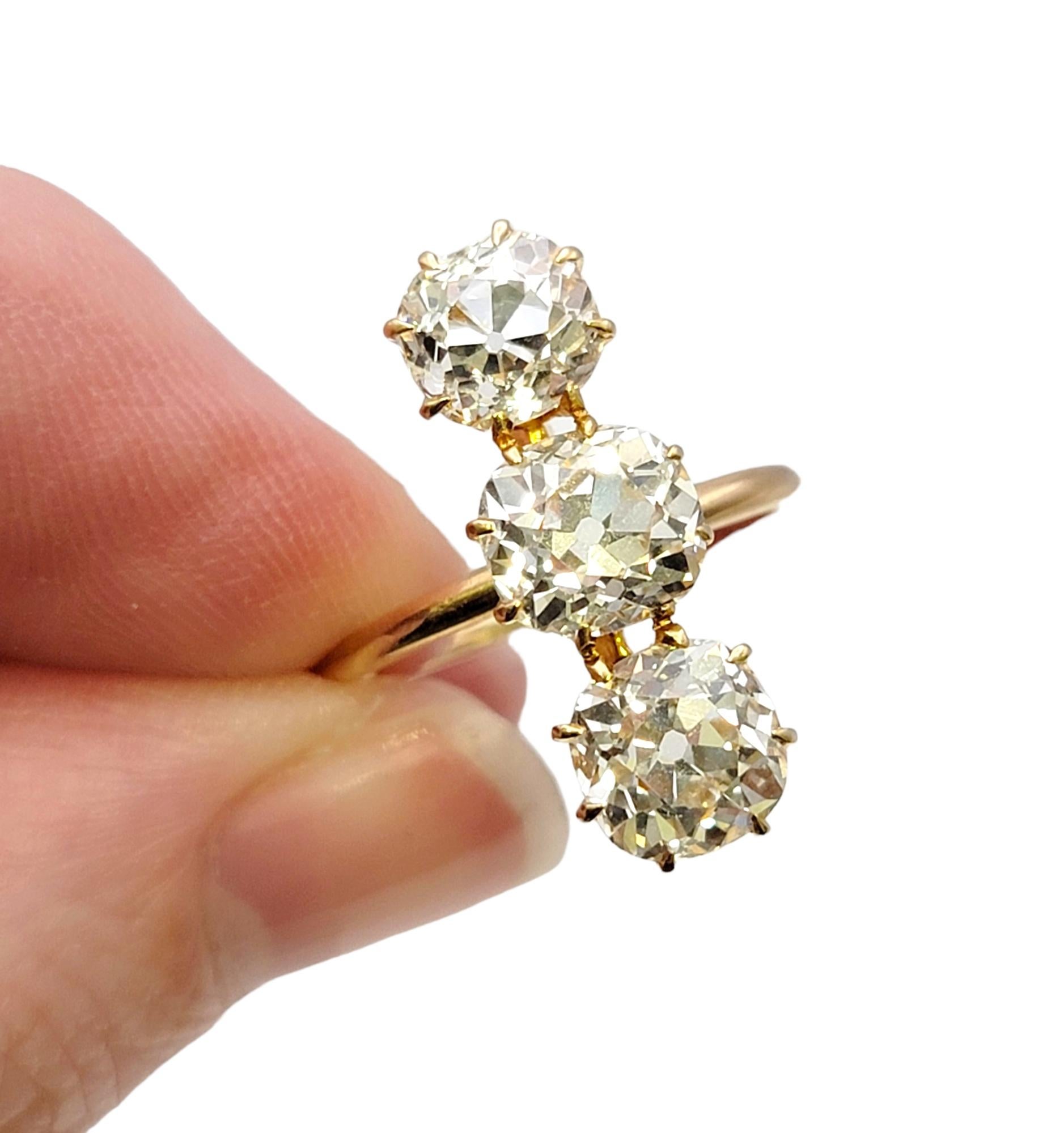 3.88 Carat Total Three-Stone Old Mine Cut Diamond Elongated 14 Karat Gold Ring For Sale 5