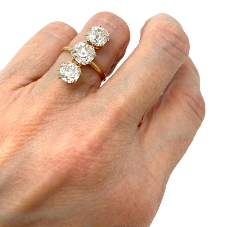 3.88 Carat Total Three-Stone Old Mine Cut Diamond Elongated 14 Karat Gold Ring For Sale 6