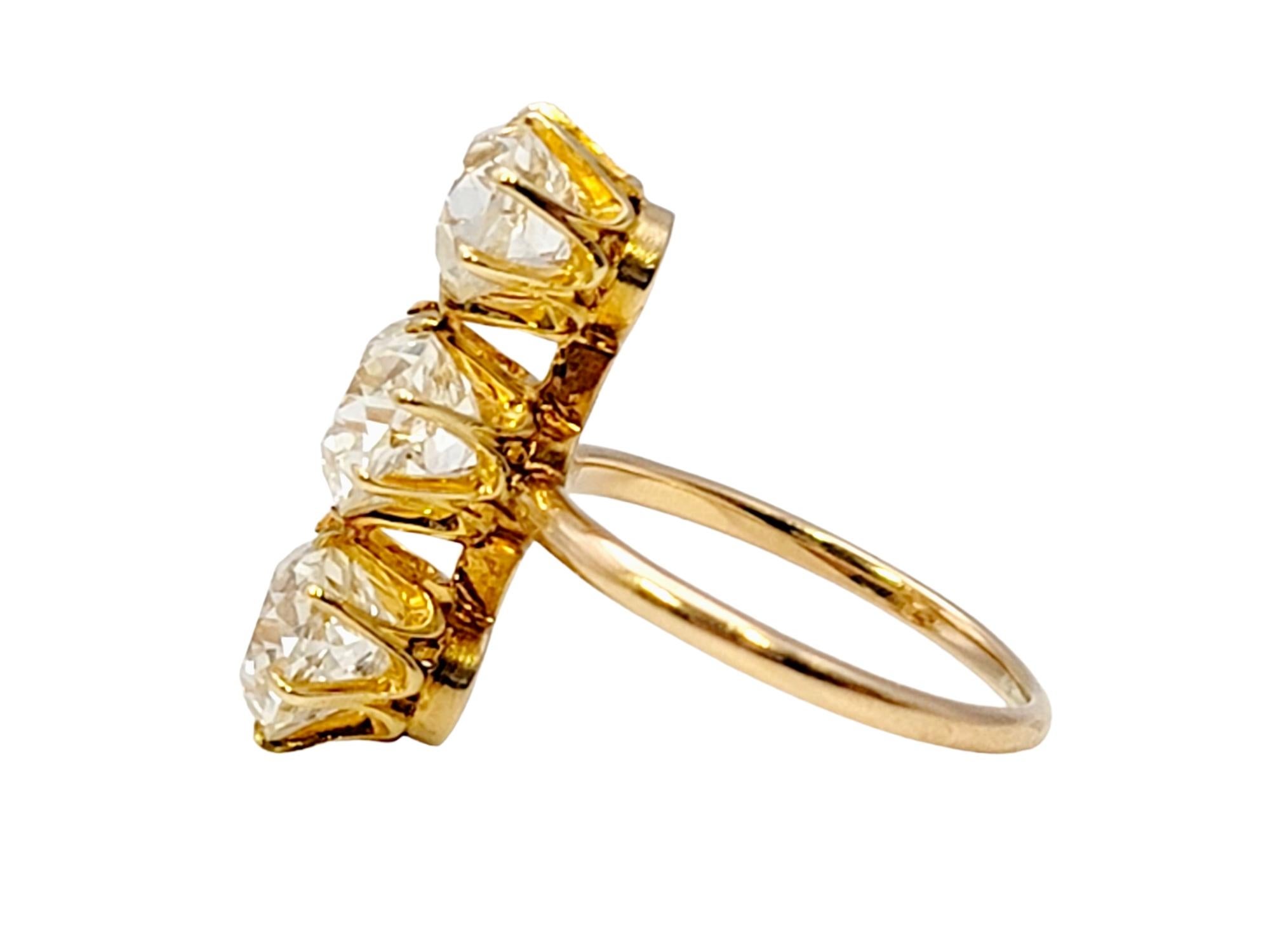 Contemporary 3.88 Carat Total Three-Stone Old Mine Cut Diamond Elongated 14 Karat Gold Ring For Sale