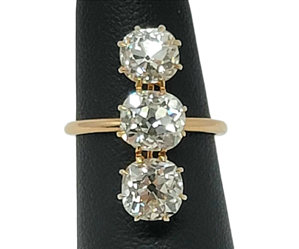 3.88 Carat Total Three-Stone Old Mine Cut Diamond Elongated 14 Karat Gold Ring For Sale 2