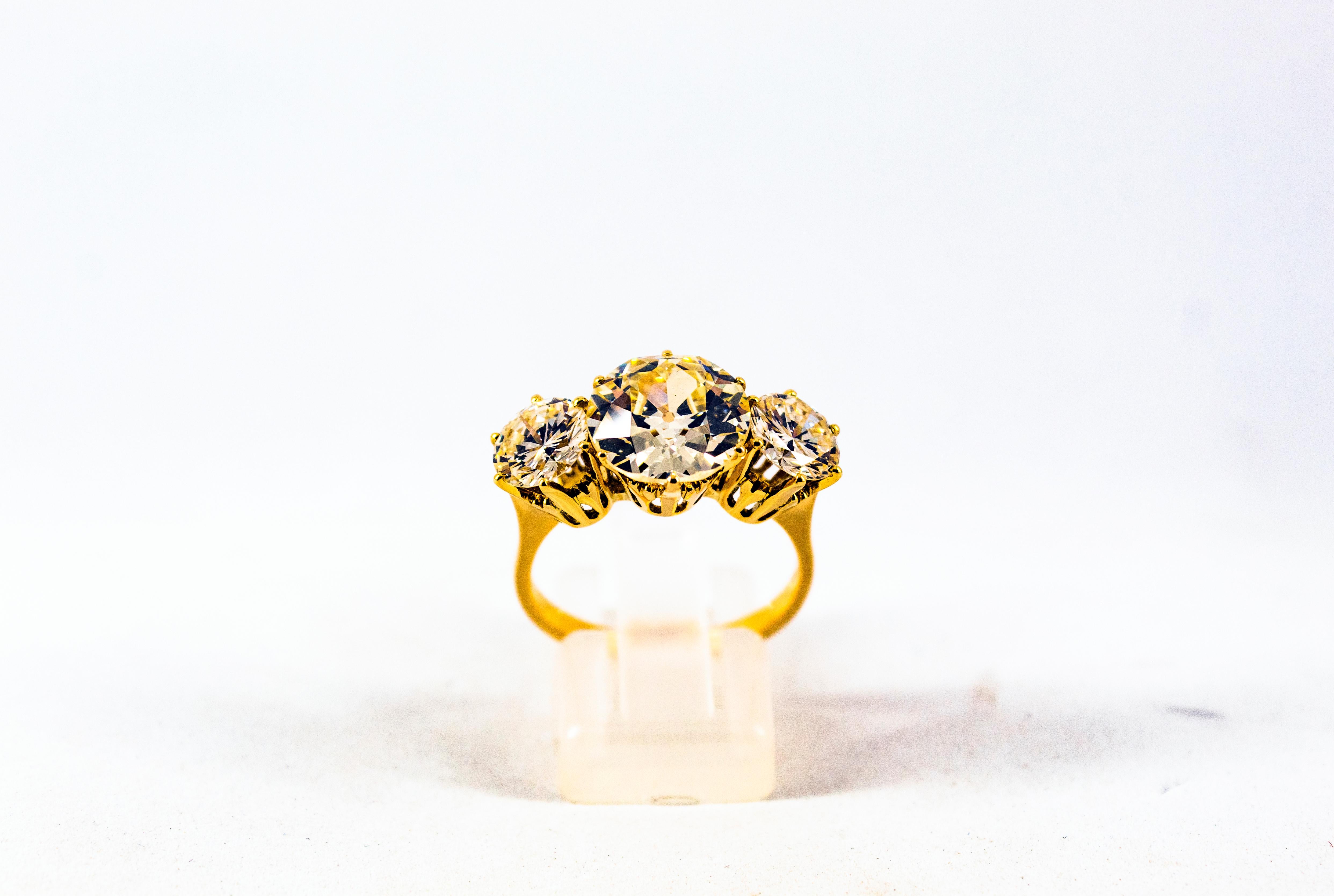 This Ring is made of 18K Yellow Gold.
This Ring has a Central 3.88 Carats White Old European Cut Diamond.
Color: M Clarity: VVS1
This Ring has 2.04 Carats of White Modern Round Cut Diamonds.
They are two 1.02 Carats Diamonds. Color: L Clarity: