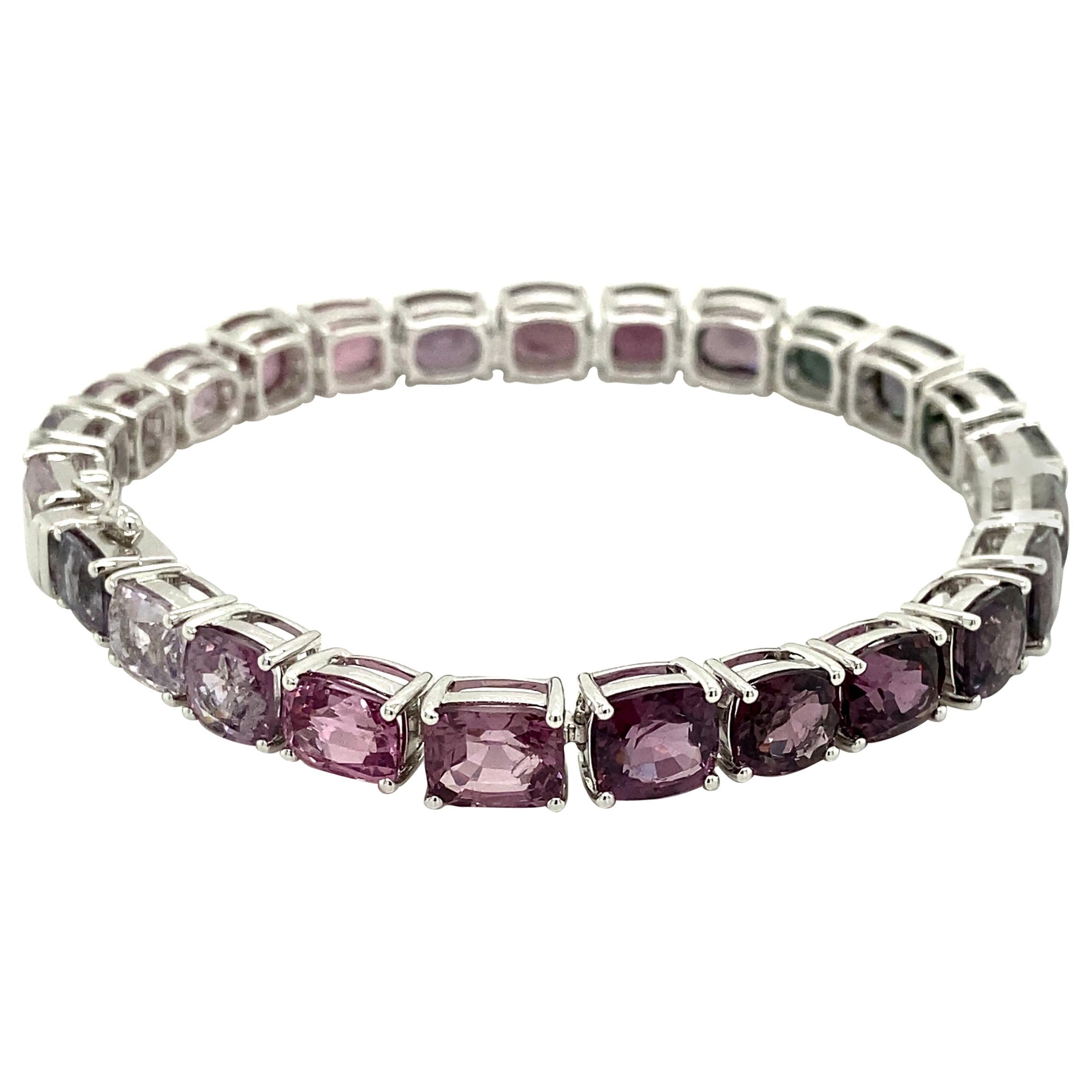 38.84 Carat Unheated Multicoloured Burmese Spinels White Gold Bracelet:

A beautiful bracelet, it features 25 luscious multicoloured unheated Burmese spinels weighing a total of 38.84 carat. The spinels, hailing from the legendary mines of Mogok,