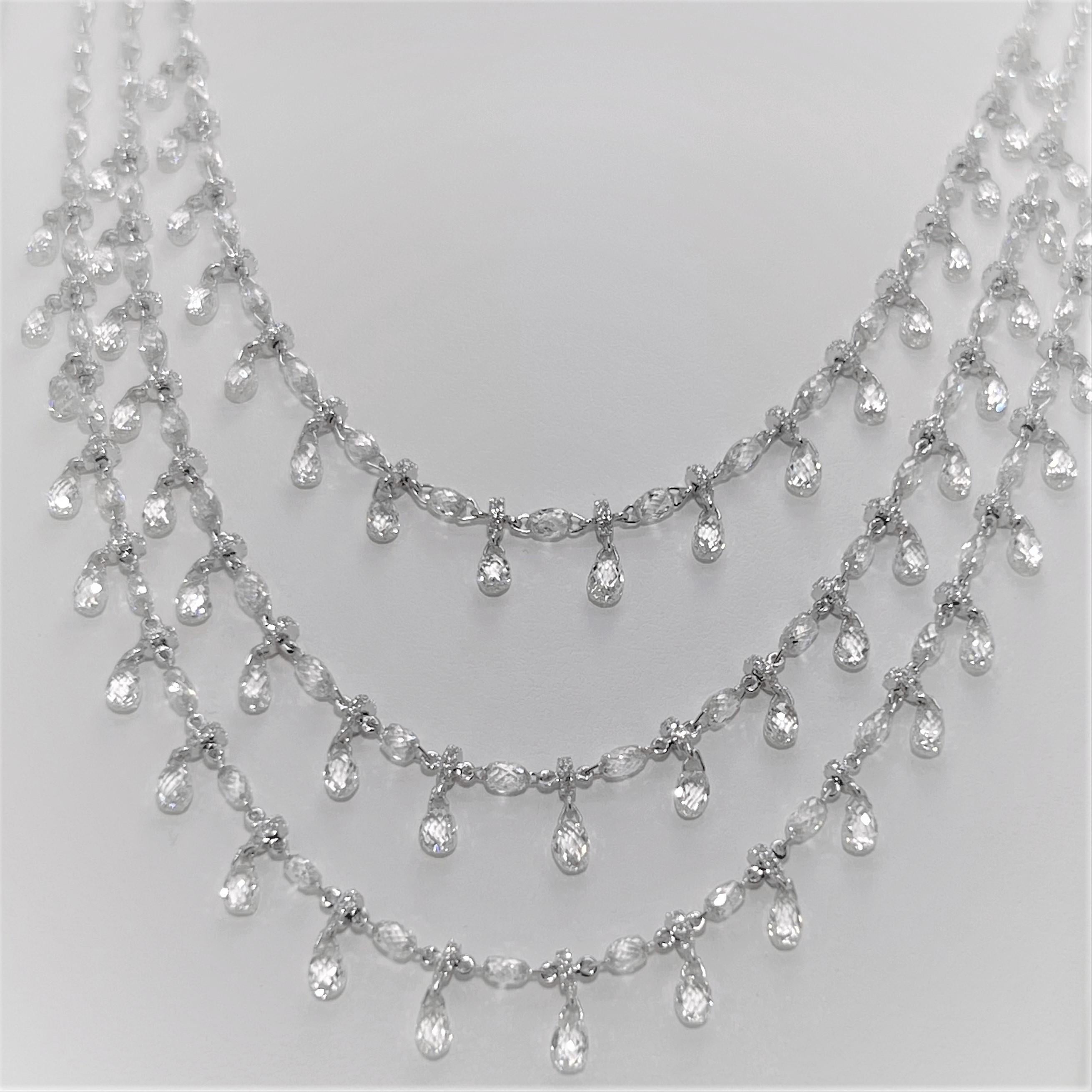 This is a fabulous 1920 inspired vintage style with intriguing 3-row Briolette Cut Diamond Necklace.  Embellished with 841 Diamonds weighing 38.89 carats in total, this remarkable multi strand necklace is set on 18 Karat White Gold.  A perfect