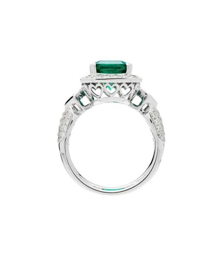 One of a kind 3.89 Carat Emerald Cut Colombian Emerald and Diamonds in Gold.

*RING* One (1) eighteen karat (18kt) white gold Colombian Emerald and Diamond ring featuring; one heart prong set emerald cut genuine Colombian Emerald weighing