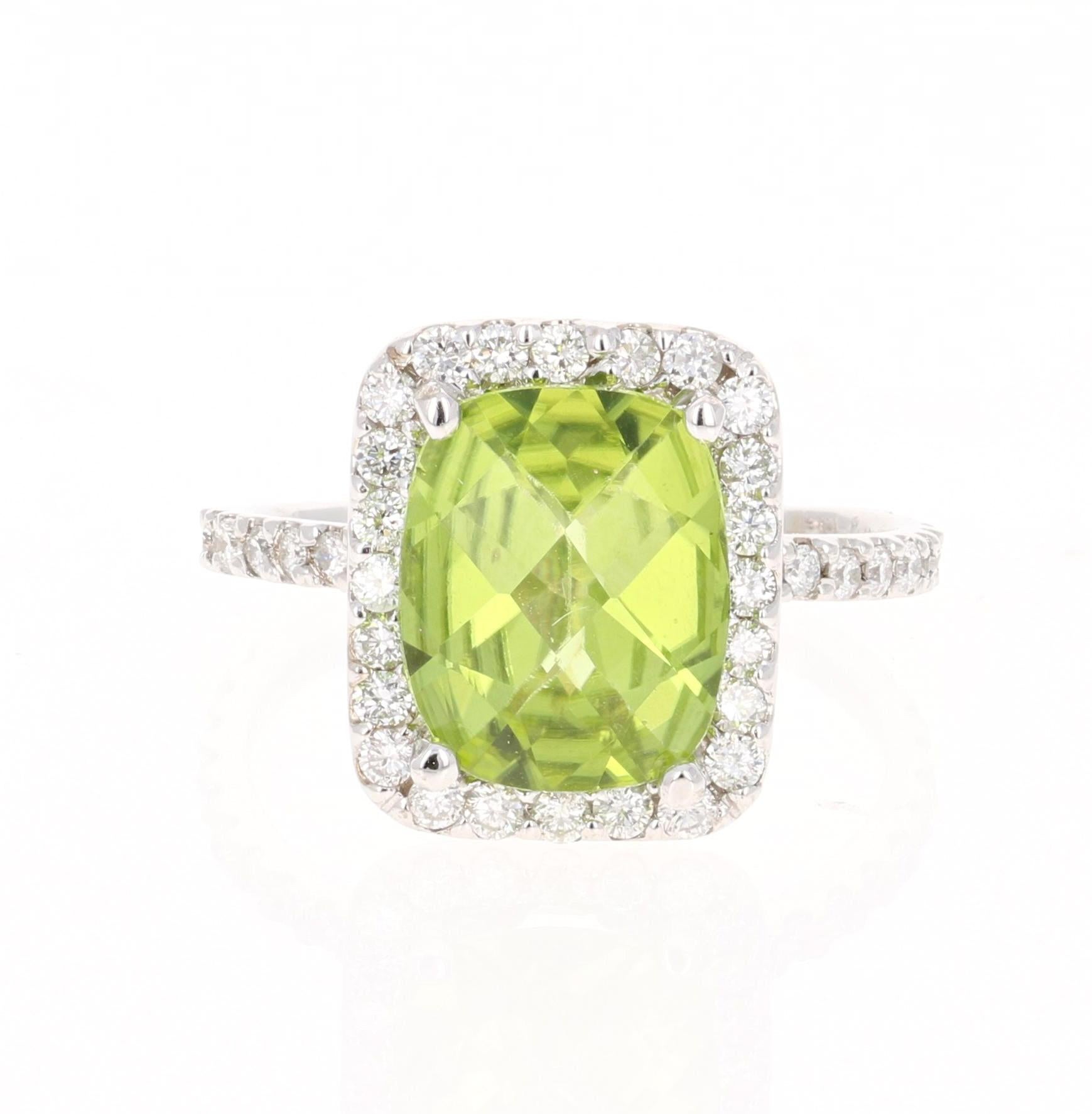3.89 Carat Peridot Diamond Engagement White Gold Ring - this can be a stunning and unique alternative to an engagement ring!

This beautiful ring has a Oval/Cushion Cut Peridot in the center that weighs 3.25 Carats. The ring is surrounded by a