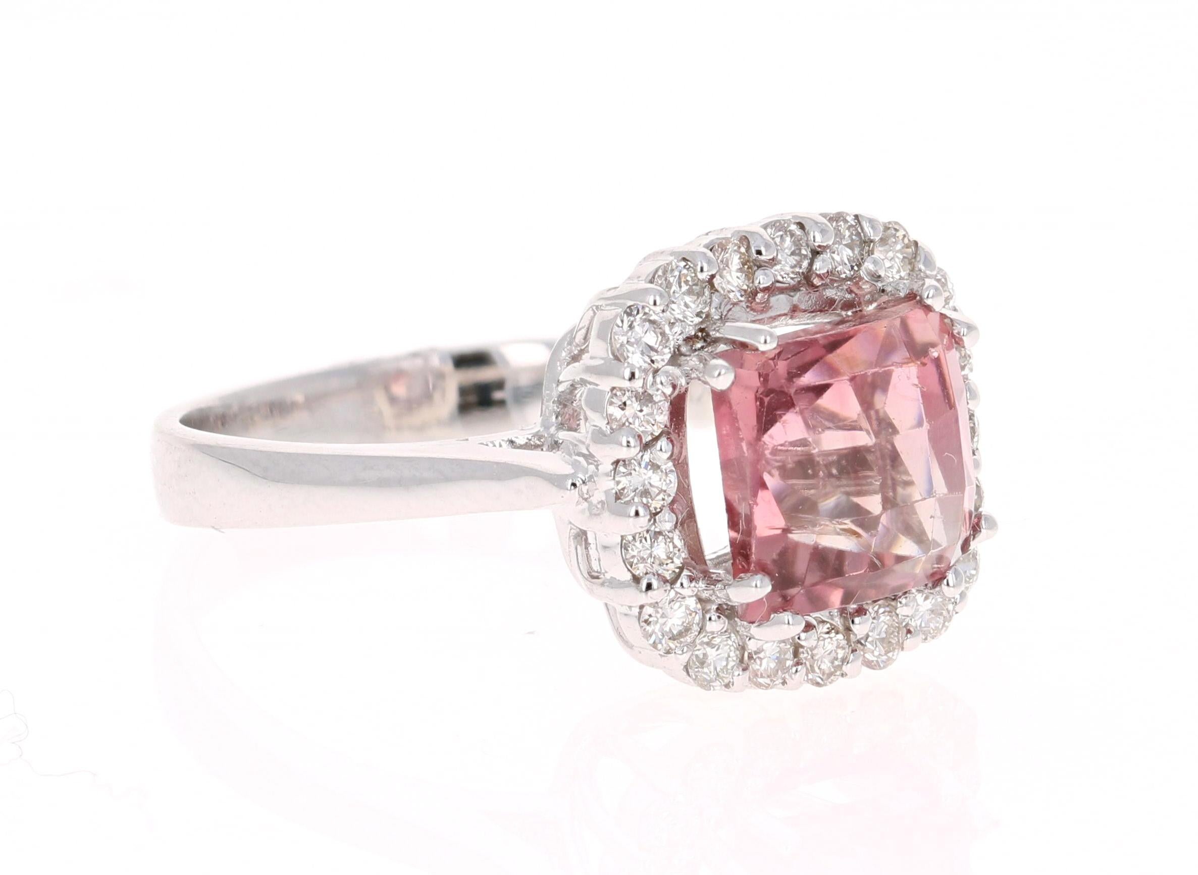 Sexy and Sultry Mauvish Pink Tourmaline and Diamond Ring!

This ring has a gorgeous Square Cut Pink Tourmaline that weighs 3.35 Carats. Floating around the tourmaline are 20 Round Cut Diamonds that weigh 0.54 Carats (VS-H).
The total carat weight of