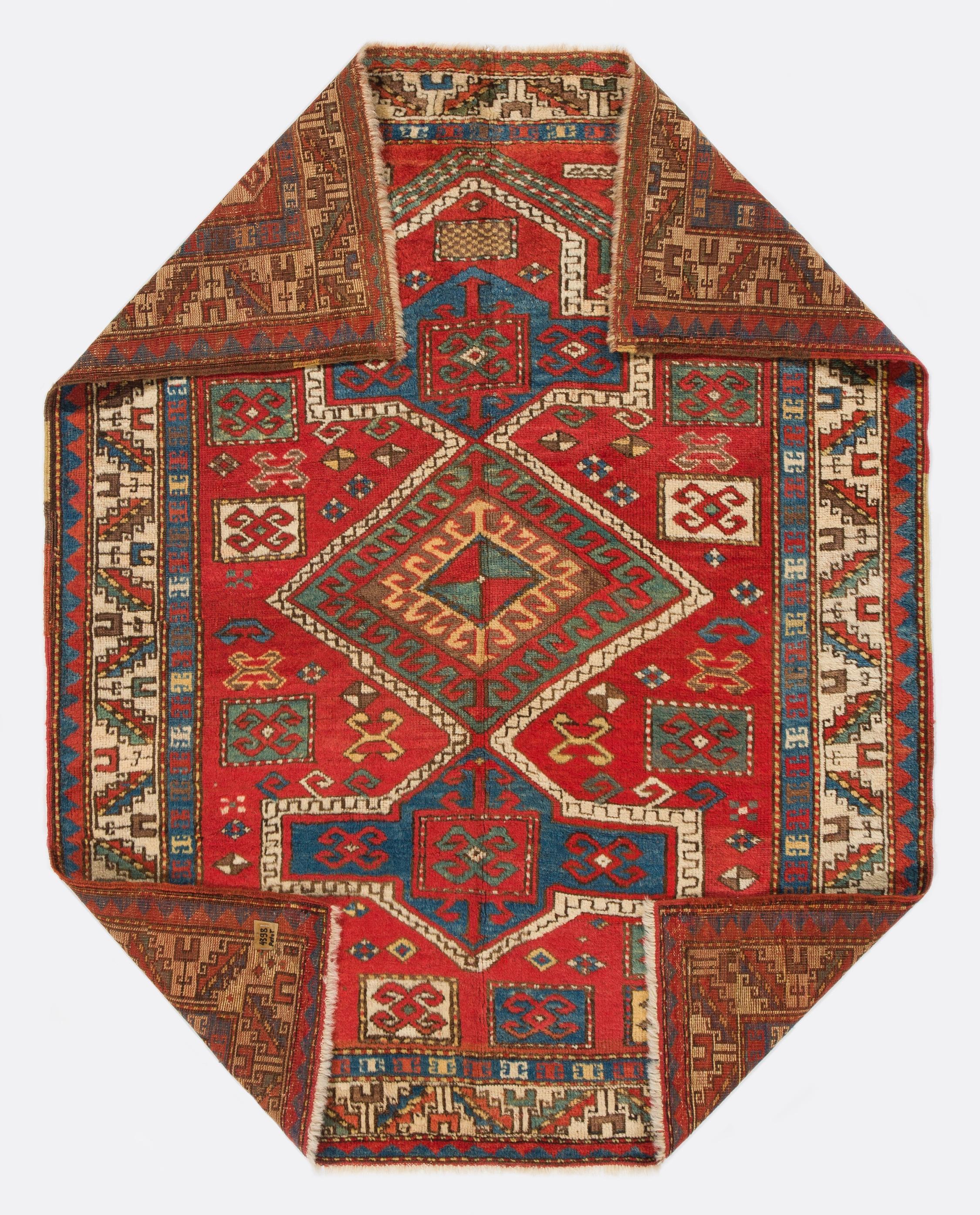 An antique Caucasian Fachralo Kazak Prayer rug. Finely hand-knotted with even medium wool pile on wool foundation. Very good condition. Sturdy and as clean as a brand new rug (deep washed professionally). Measures: 3.8 x 4.8 ft.