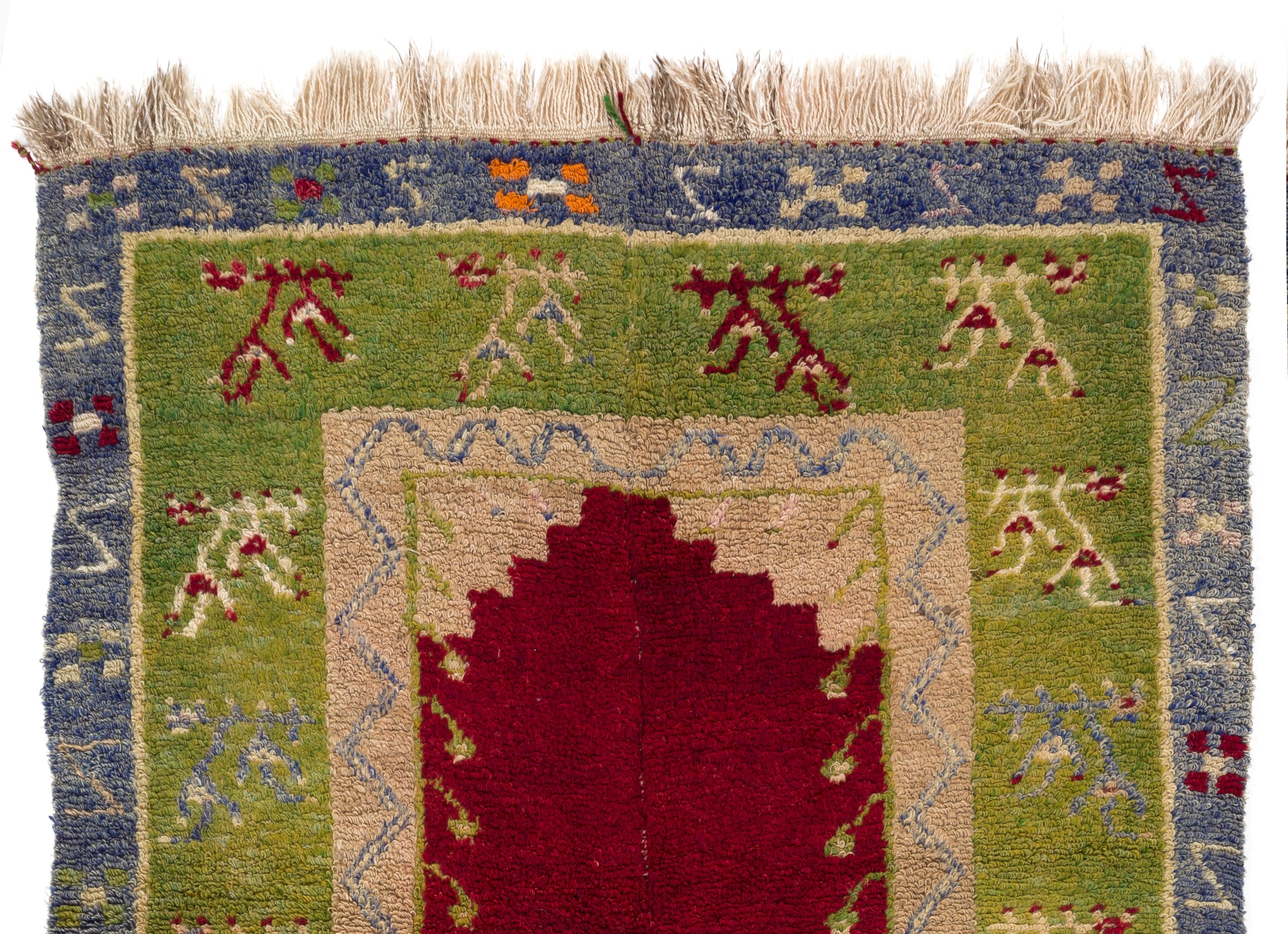 This one-of-a-kind vintage tulu rug is made of hand-spun and hand-dyed lamb’s wool, therefore it is very soft and luscious and feels comfortable under your feet. The rug has a niche design surrounded with bunches of stylized flowers in a warm and