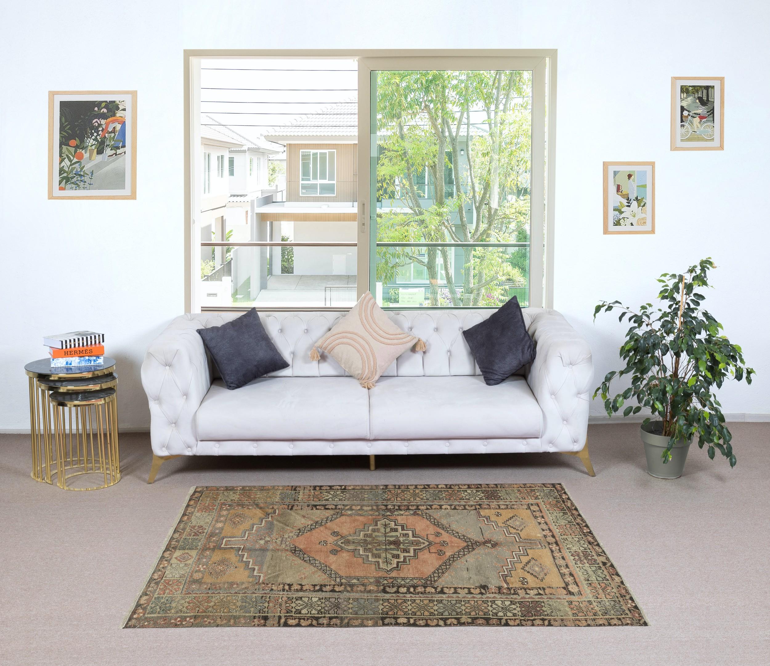 Add a touch of timeless elegance to your home with this traditional vintage hand knotted Turkish area rug, crafted from 100% premium wool. This exquisite piece captures the essence of traditional Anatolian craftsmanship, featuring intricate patterns