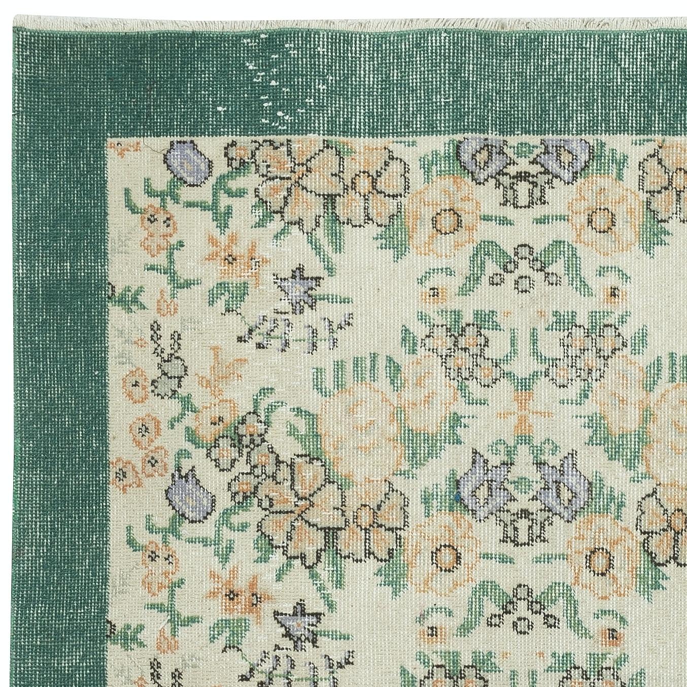 Hand-Knotted 3.8x6.6 Ft Vintage Handmade Turkish Rug with Floral Design & Solid Green Border For Sale