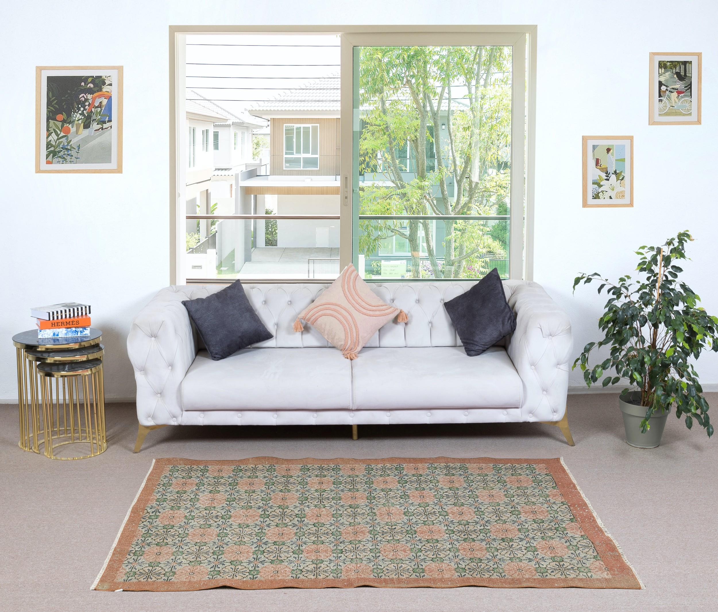 Infuse your home with the timeless beauty of this traditional vintage handmade Turkish rug, a hand-knotted masterpiece crafted from a luxurious blend of wool and cotton. Woven by skilled artisans using centuries-old techniques, this rug features