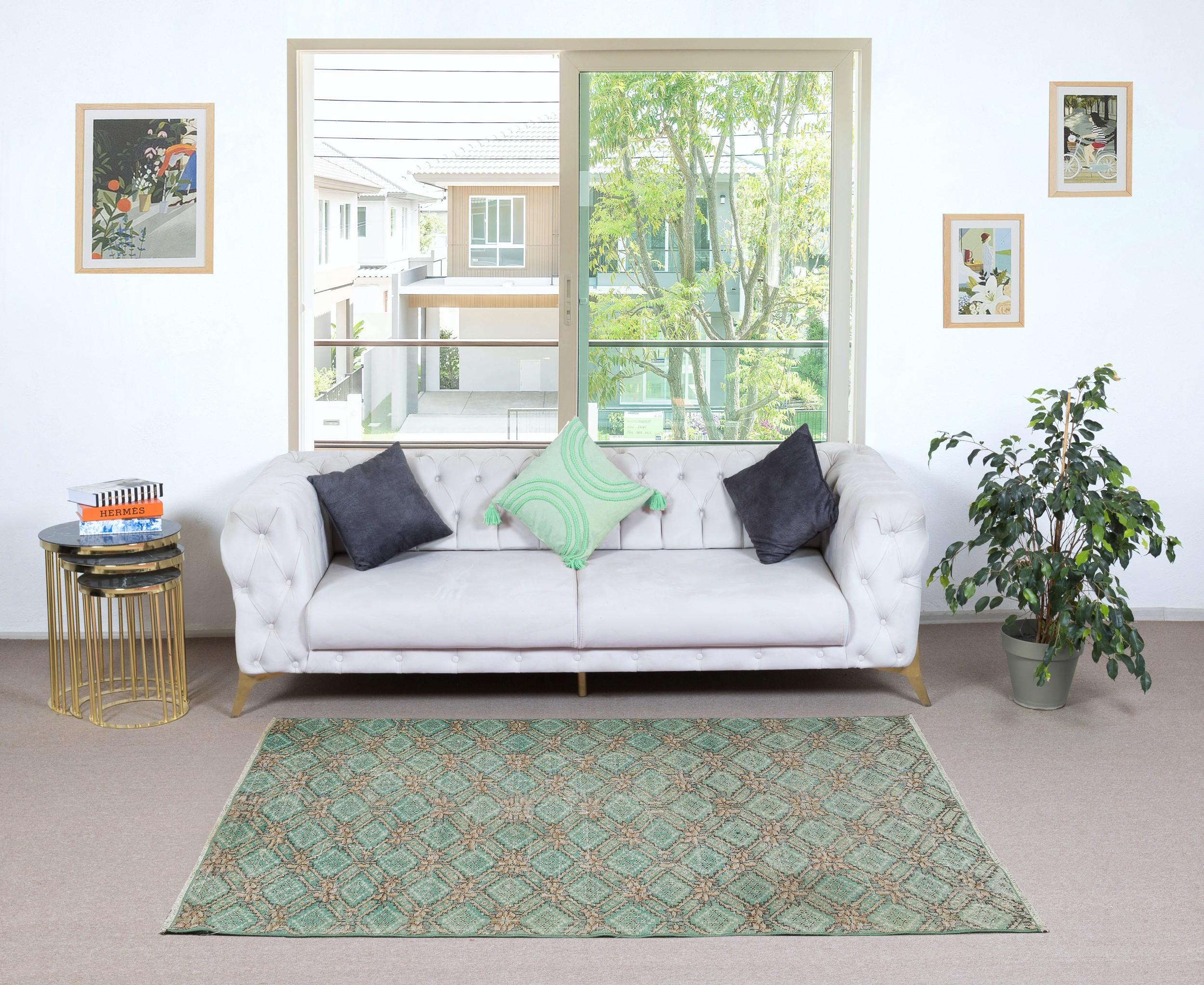 Infuse your home with the timeless beauty of this traditional vintage handmade Turkish rug, a hand-knotted masterpiece crafted from a luxurious blend of wool and cotton. Woven by skilled artisans using centuries-old techniques, this rug features