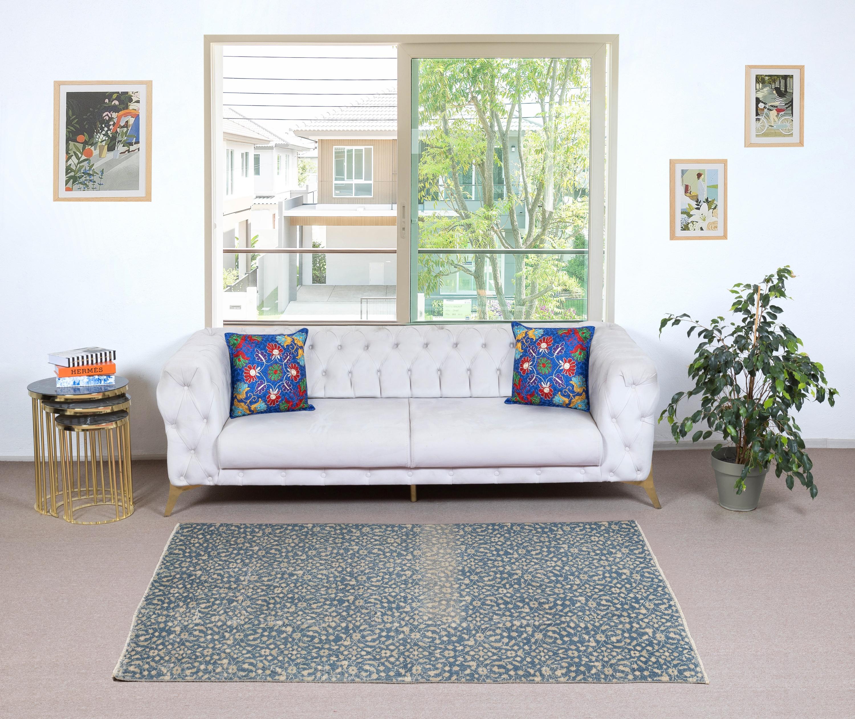 Infuse your home with the timeless beauty of this traditional vintage handmade Turkish rug, a hand-knotted masterpiece crafted from a luxurious blend of wool and cotton. Woven by skilled artisans using centuries-old techniques, this rug features