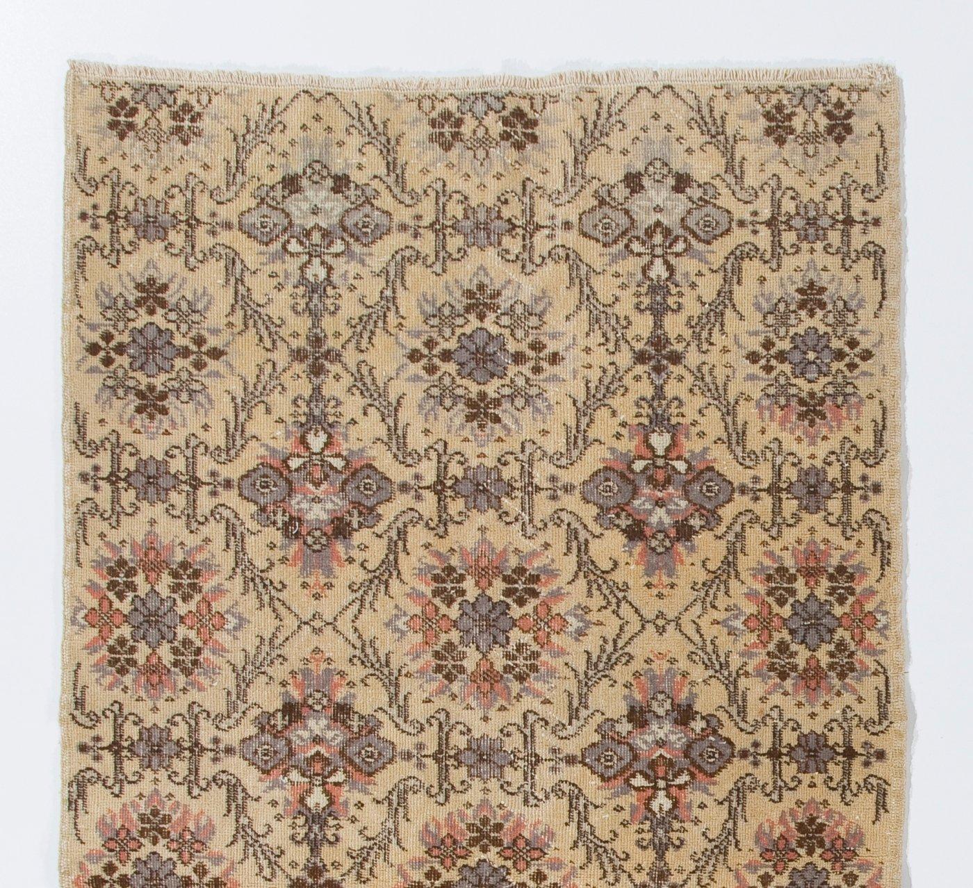 A vintage rug from Central Turkey. Finely hand-knotted with even medium wool pile on cotton foundation. Very good condition. Sturdy and as clean as a brand new rug (deep washed professionally). Measures: 3.8 x 7.3 ft.
     