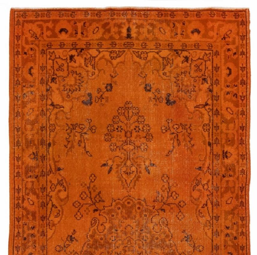 A vintage Turkish area rug re-dyed in burnt orange color for contemporary interiors. 
Finely hand knotted, low wool pile on cotton foundation. Professionally washed.
Sturdy and can be used on a high traffic area, suitable for both residential and